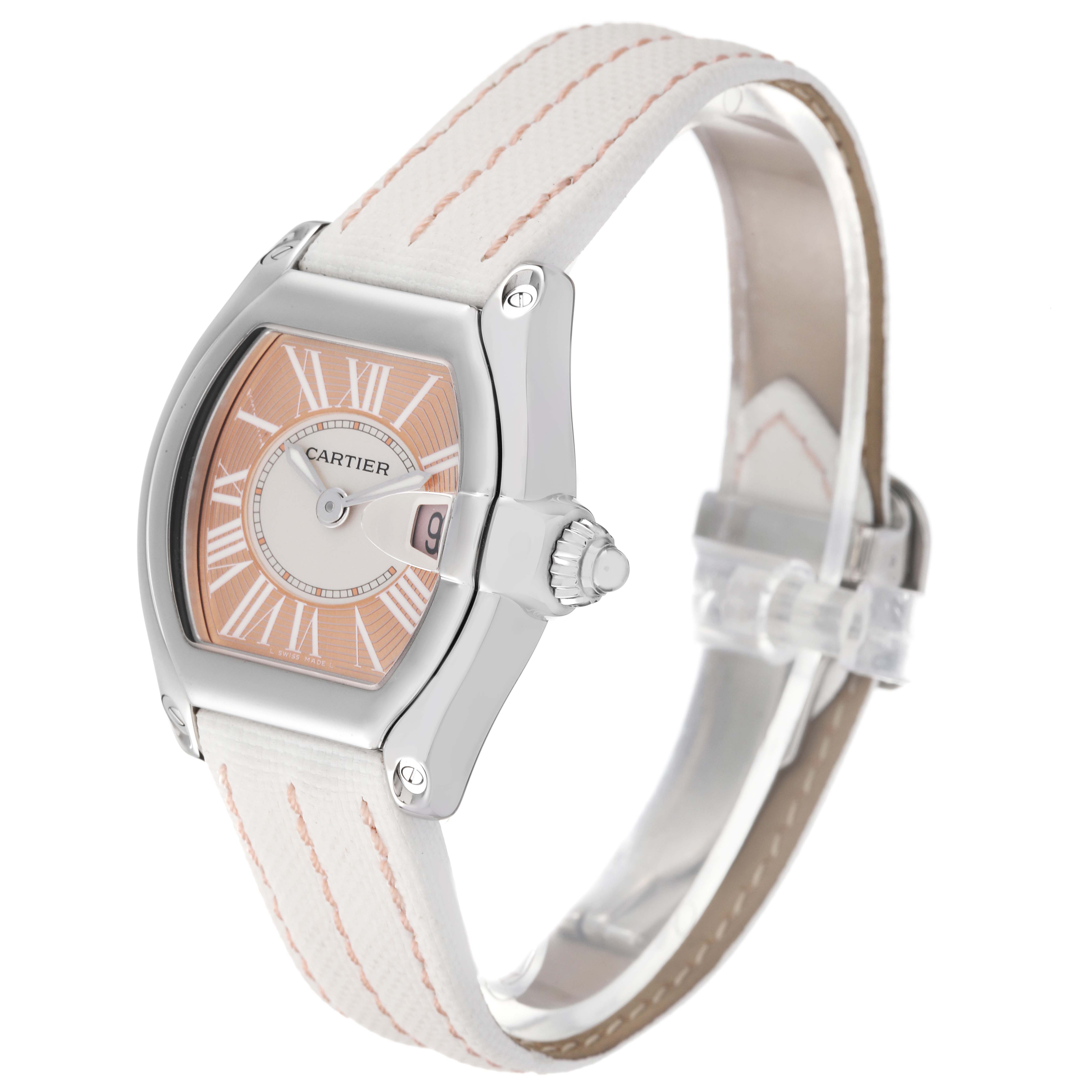 The Cartier Roadster W62054V3 Women's Stainless Steel Pink Dial W62054V3 Women's Stainless Steel Pink Dial watch is shown at an angle displaying the face, crown, and white strap with pink stitching.