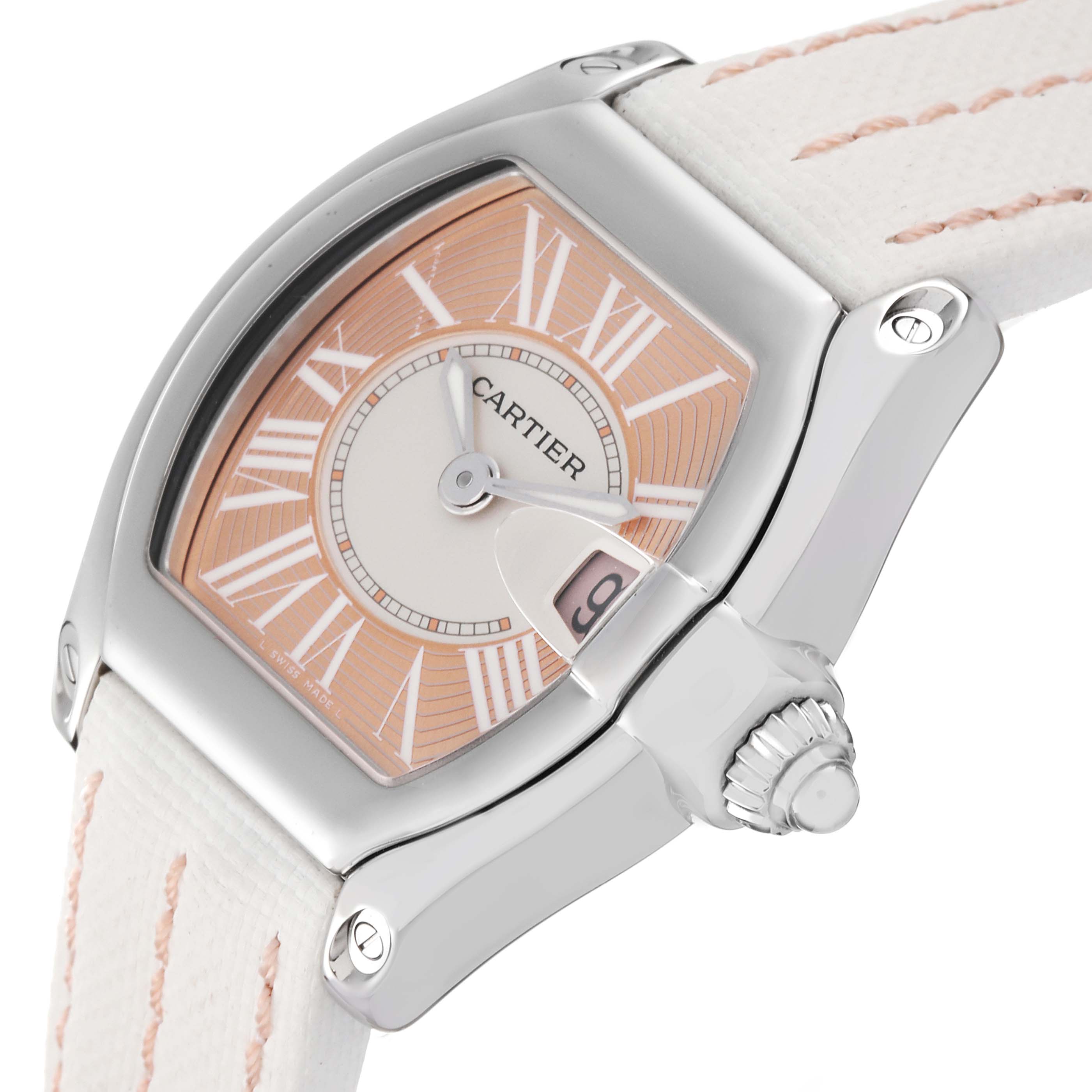 The image shows a close-up of the Cartier Roadster W62054V3 Women's Stainless Steel Pink Dial W62054V3 Women's Stainless Steel Pink Dial watch from the three-quarter angle, highlighting the face, crown, and part of the strap.