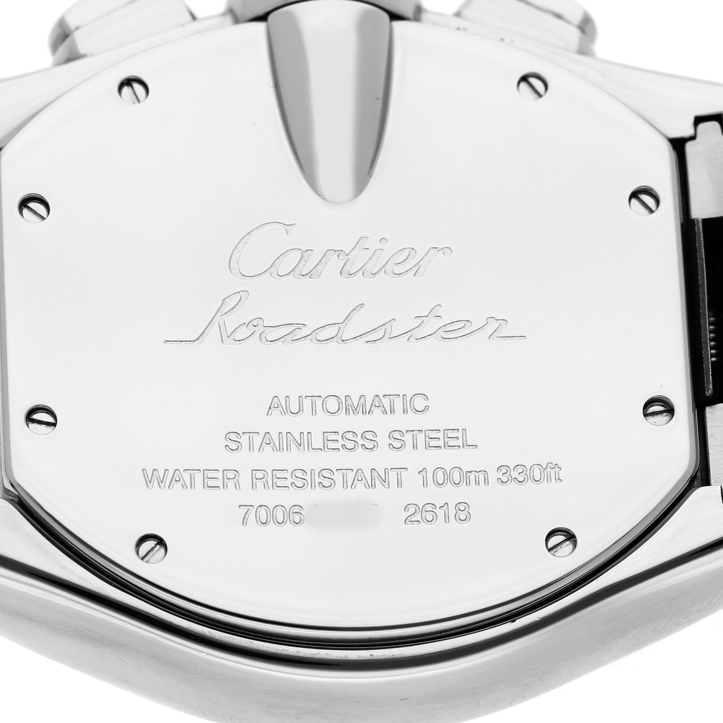 The image shows the back of a Cartier Roadster W62019X6 Men's Stainless Steel Silver Dial watch, highlighting its stainless steel case and water resistance details.