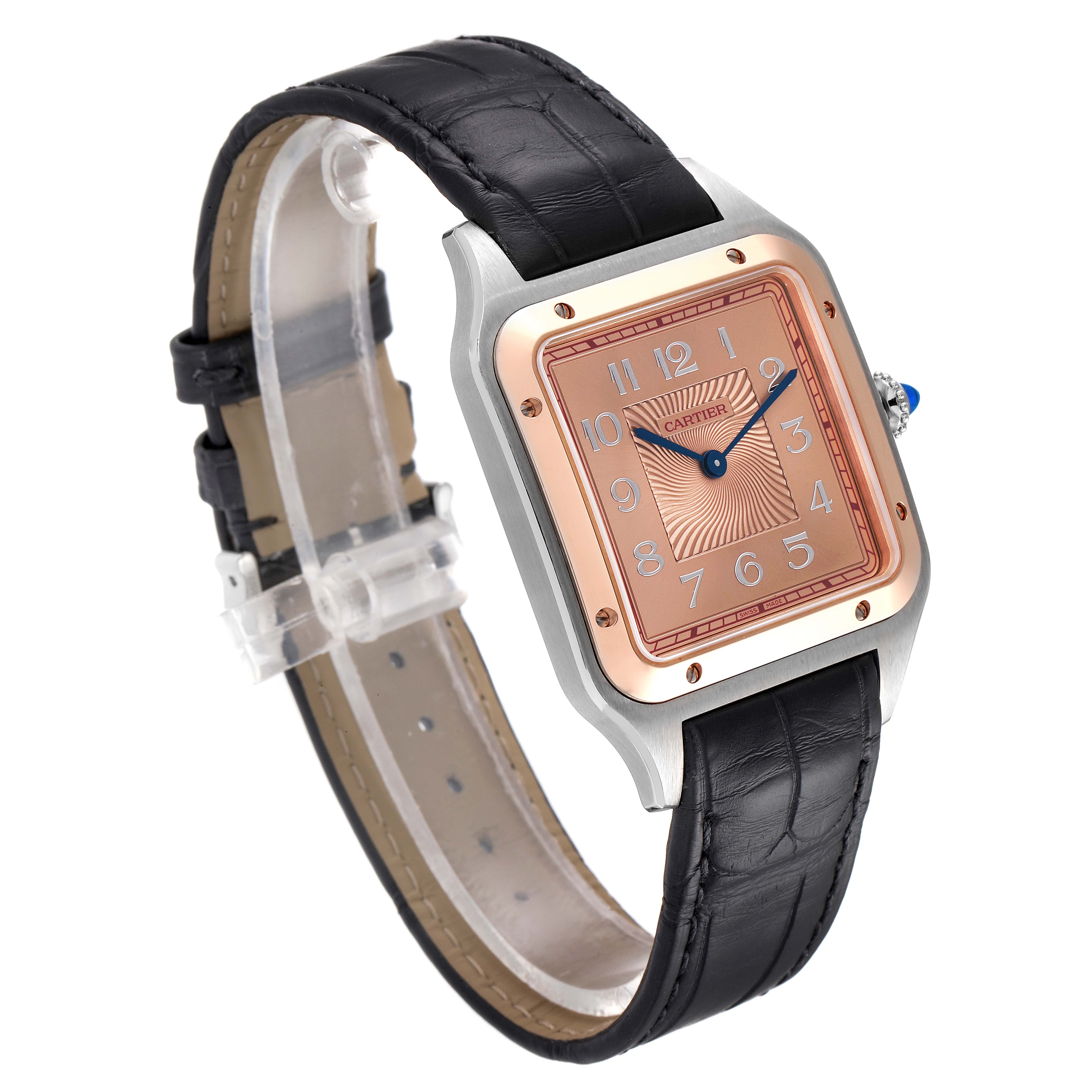 This Cartier Santos W2SA0025 Men's Steel and Gold (two tone) Pink Dial W2SA0025 Men's Steel and Gold (two tone) Pink Dial watch is shown at a slight angle, highlighting its square face, leather strap, and metallic accents.