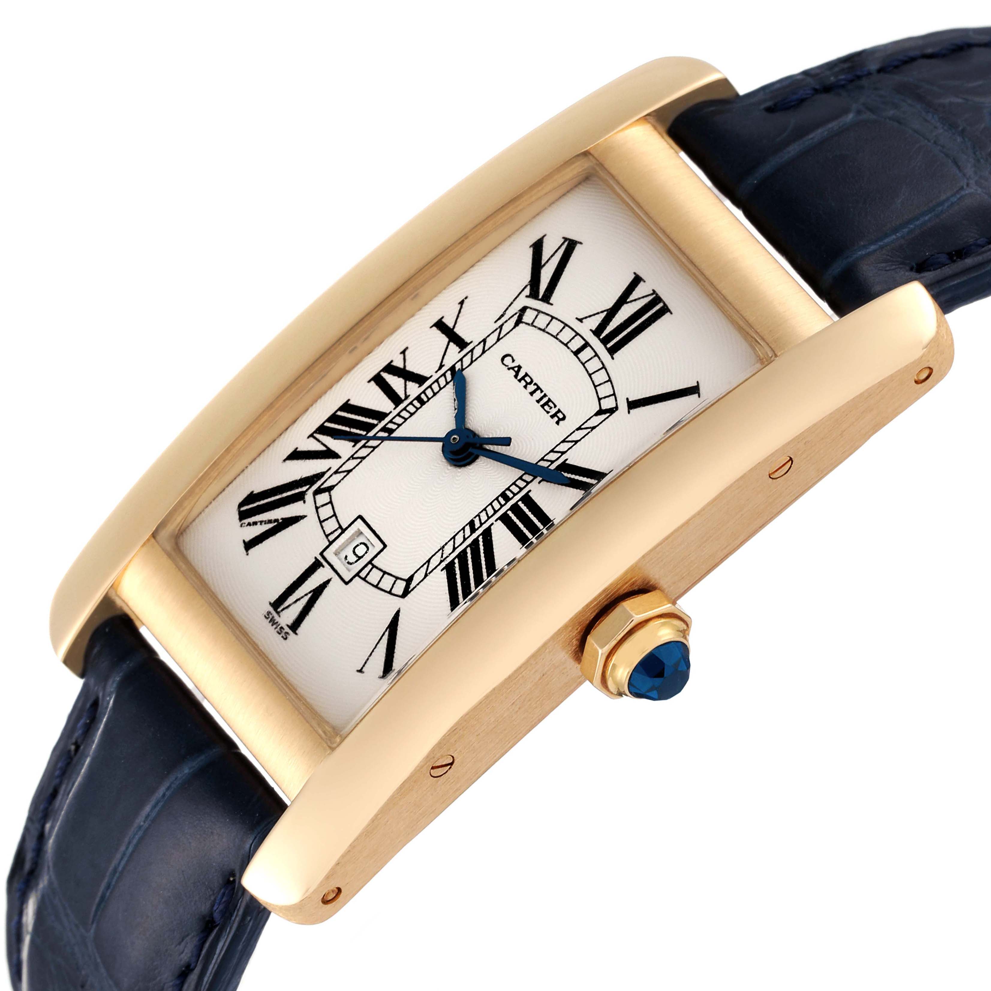 The image shows a gold Cartier Tank Americaine W2603556 Men
s Yellow Gold Silver Dial W2603556 Men
s Yellow Gold Silver Dial watch at an angle highlighting its face, strap, and crown.