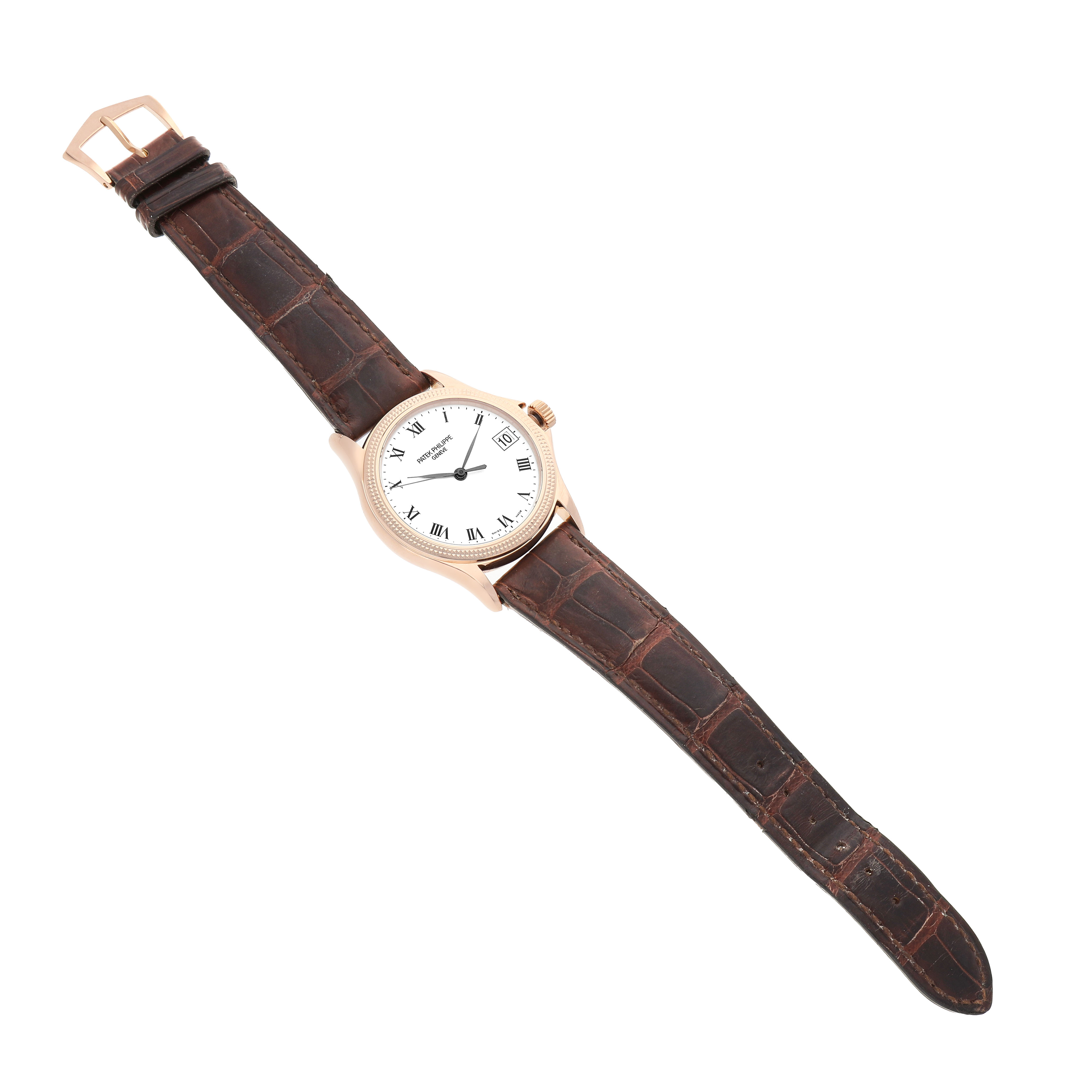 The Patek Philippe Calatrava 5117R-001 Men's Rose Gold White Dial watch is shown at a top-down angle, displaying the face, case, and leather strap.