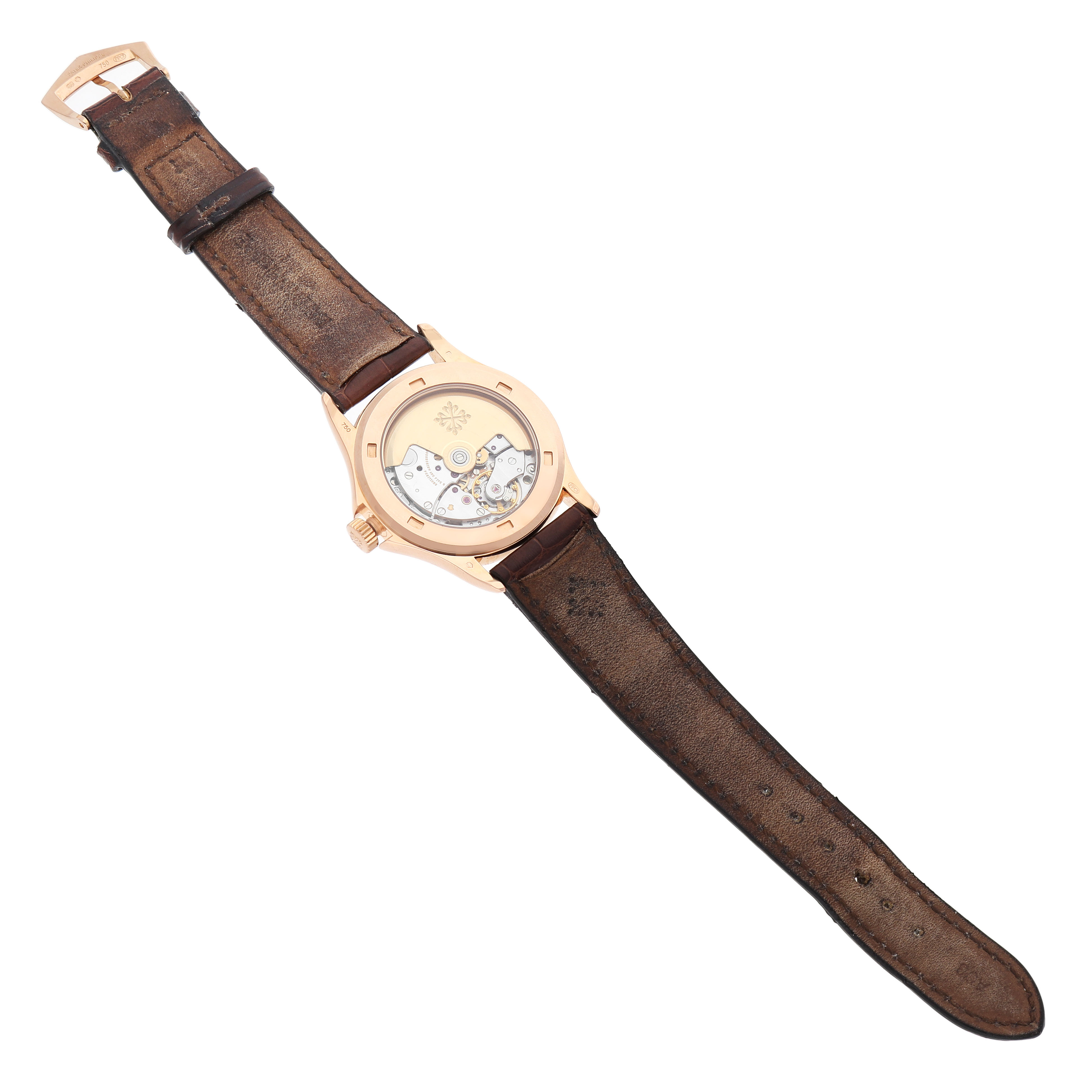 The image shows the back view of a Patek Philippe Calatrava 5117R-001 Men's Rose Gold White Dial watch highlighting the movement and the brown leather strap.