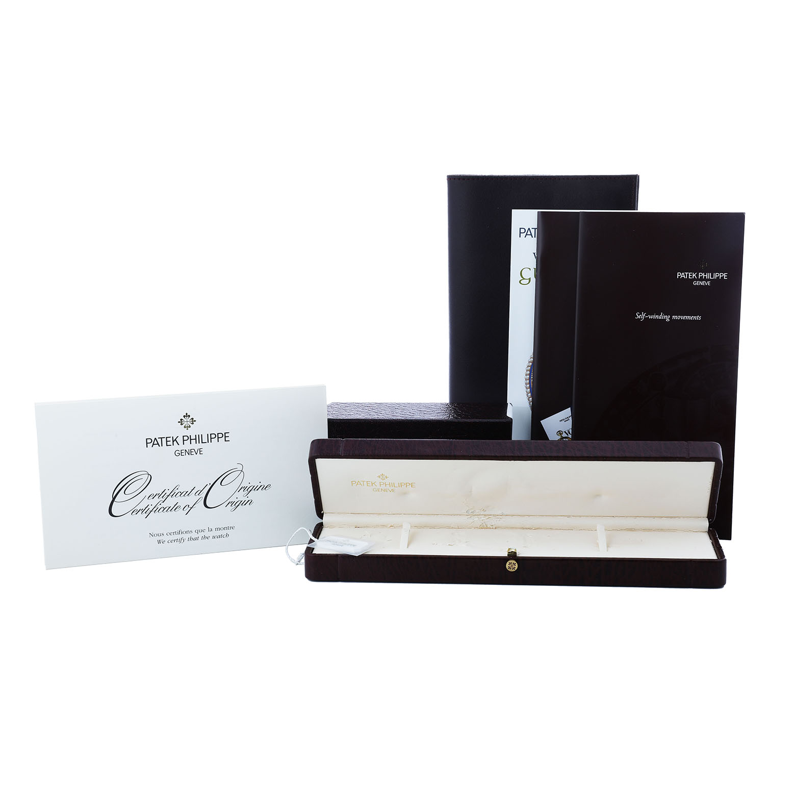 The image shows Patek Philippe Calatrava 5117R-001 Men's Rose Gold White Dial packaging, including the box, certificate, and manuals.