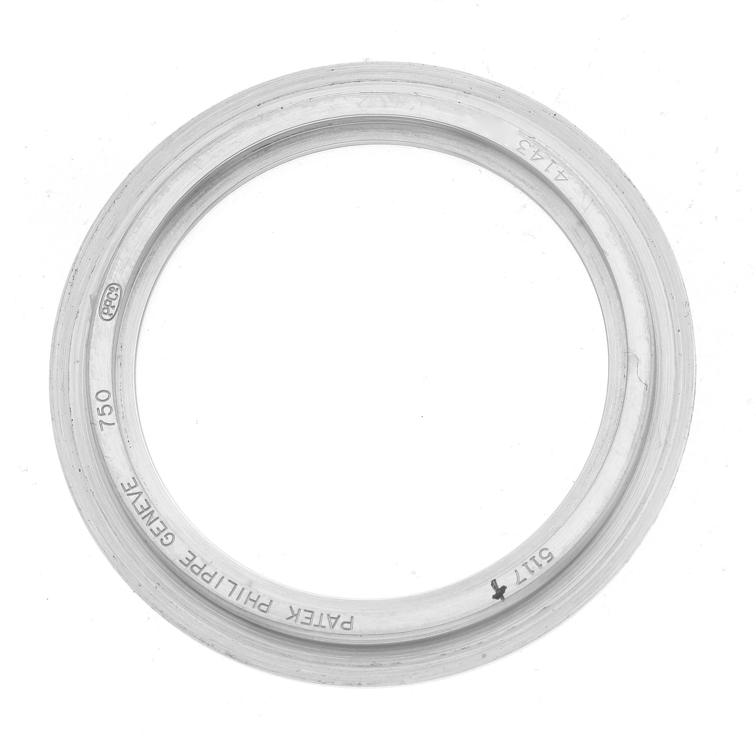 The image shows a metal bezel for a Patek Philippe Calatrava 5117G Men
s White Gold White Dial watch viewed from the top.