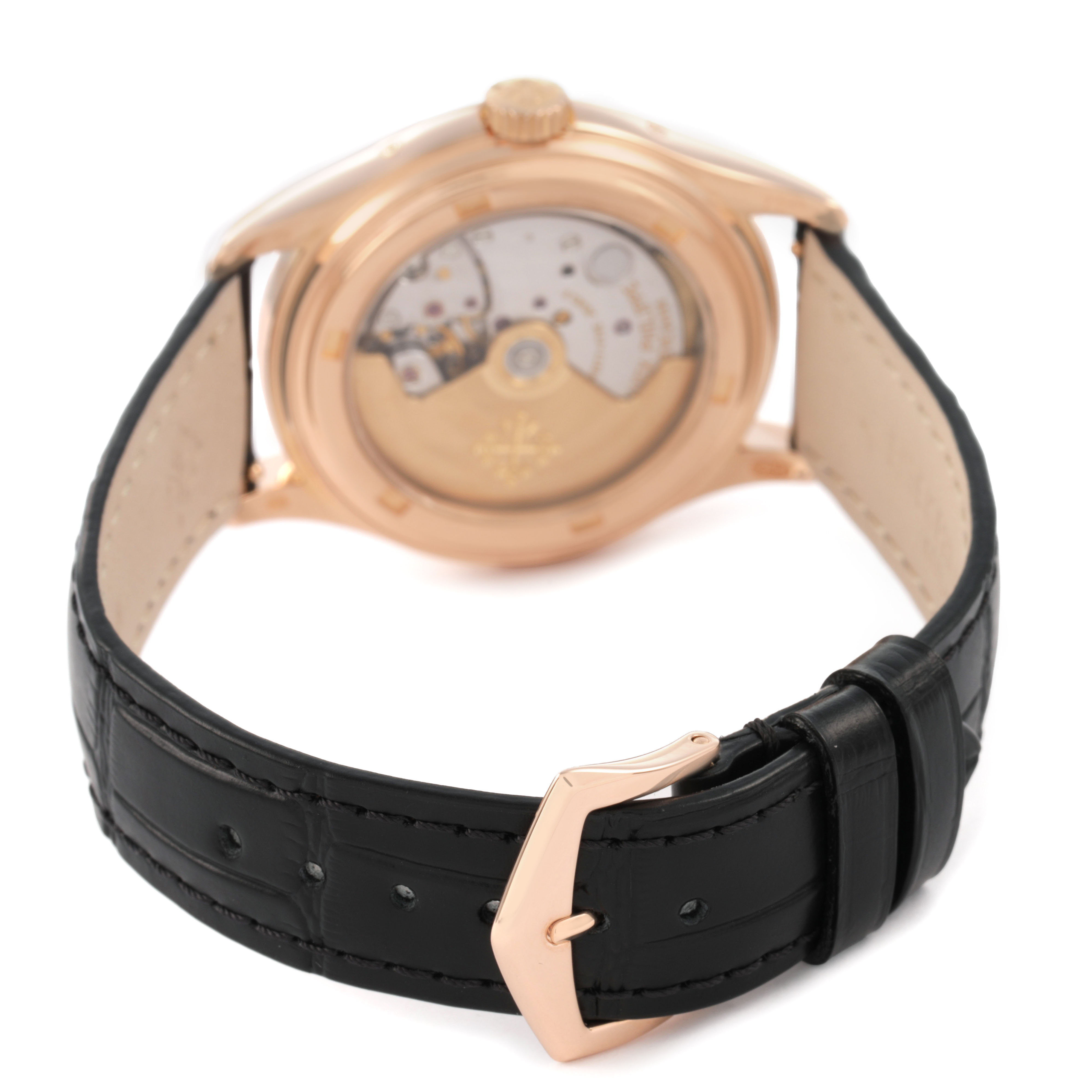 The image shows a rear view of the Patek Philippe Complications 5035R-001 Men's Rose Gold Black Dial watch, highlighting its open case back and black leather strap.
