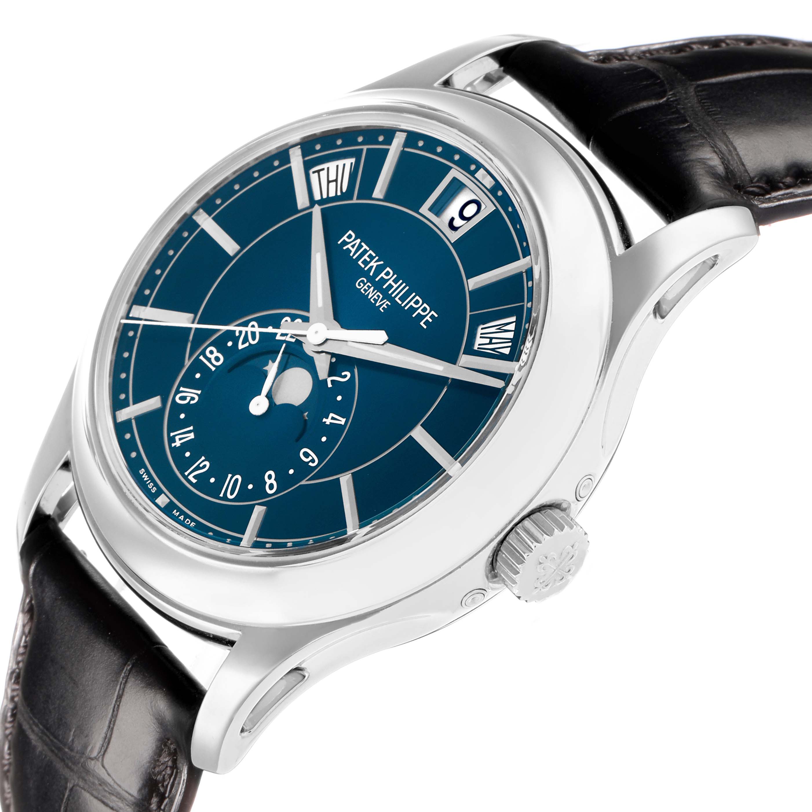 The Patek Philippe Complications 5205G-013 Men
s White Gold Blue Dial watch is shown at an angle highlighting the blue dial, crown, calendar windows, and leather strap.