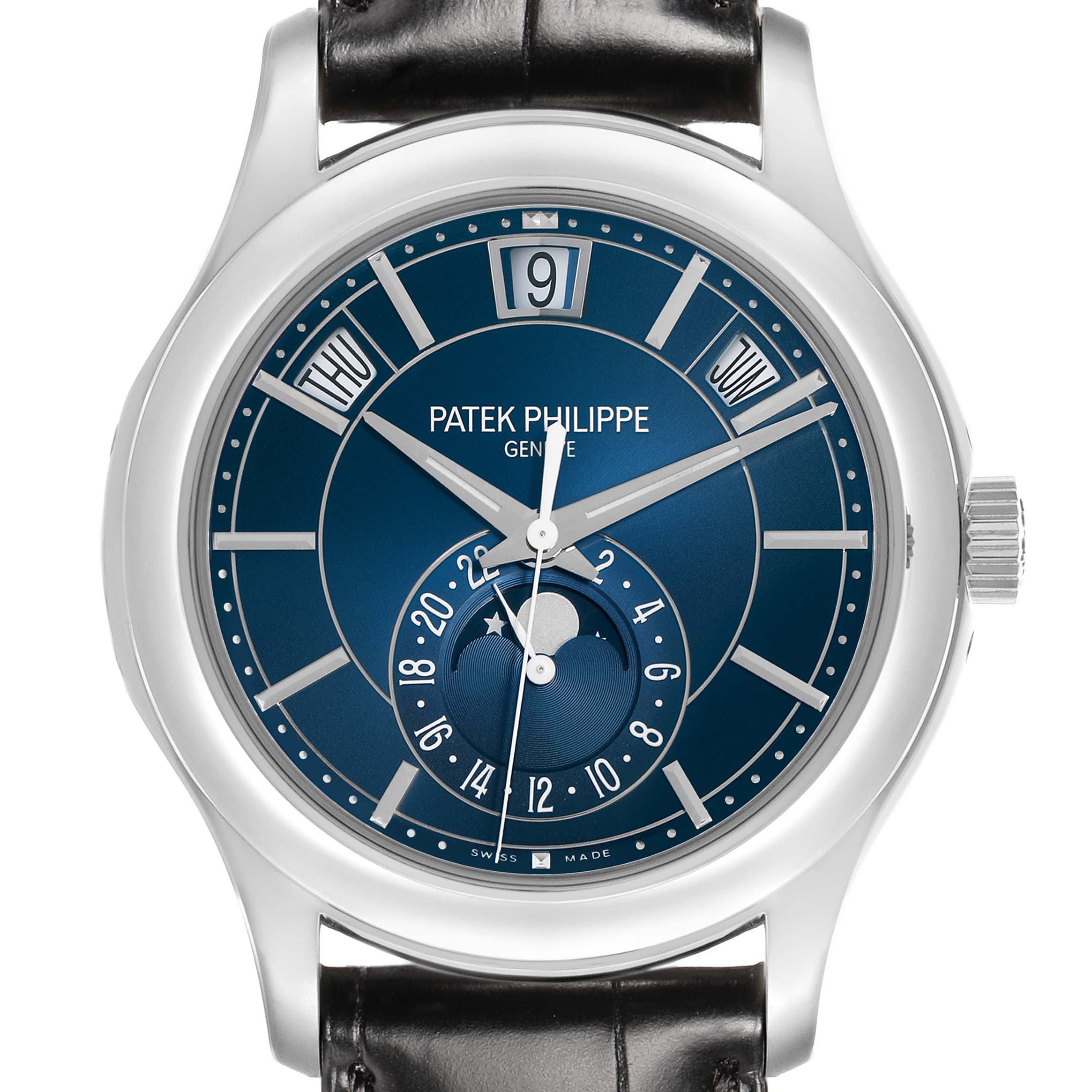 The Patek Philippe Complications 5205G-013 Men
s White Gold Blue Dial watch is shown from the front, highlighting the dial, hands, date, day, and moon phase indicators.