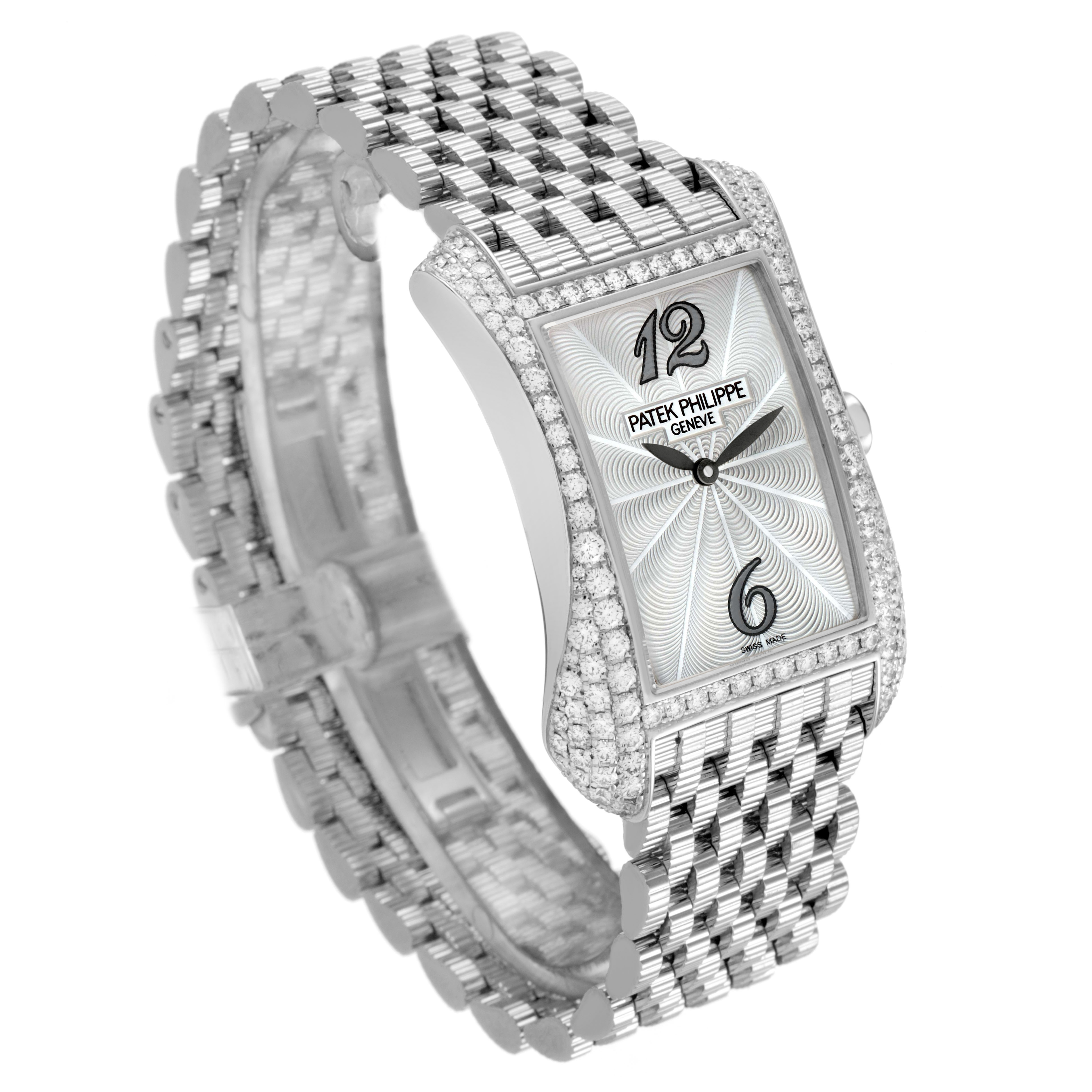 The Patek Philippe Gondolo 4972/1G-001 Women's White Gold Mother of Pearl Dial watch is shown at an angle highlighting its diamond-encrusted rectangular case and metallic bracelet.