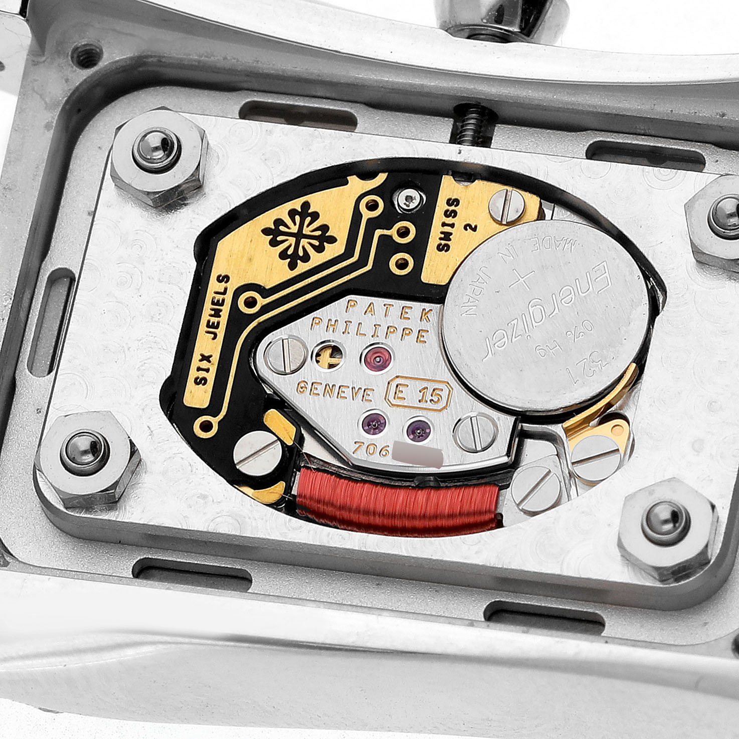 The image shows the movement mechanism of a Patek Philippe Gondolo 4972/1G-001 Women's White Gold Mother of Pearl Dial watch from the back with visible components and engravings.