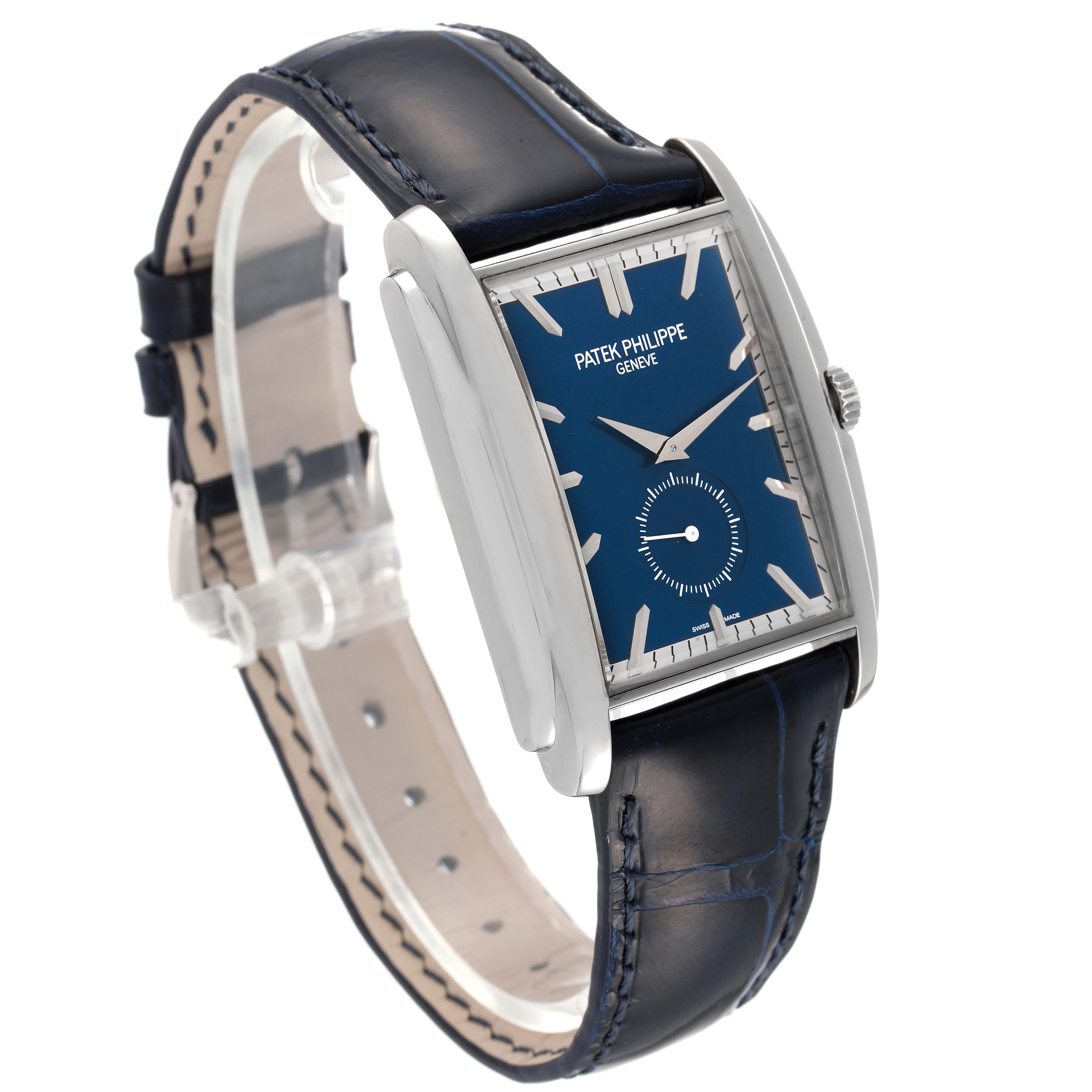 The image shows a side angle of the Patek Philippe Gondolo 5124G Men's White Gold Blue Dial 5124G Men's White Gold Blue Dial watch, highlighting its blue dial, leather strap, and rectangular case.