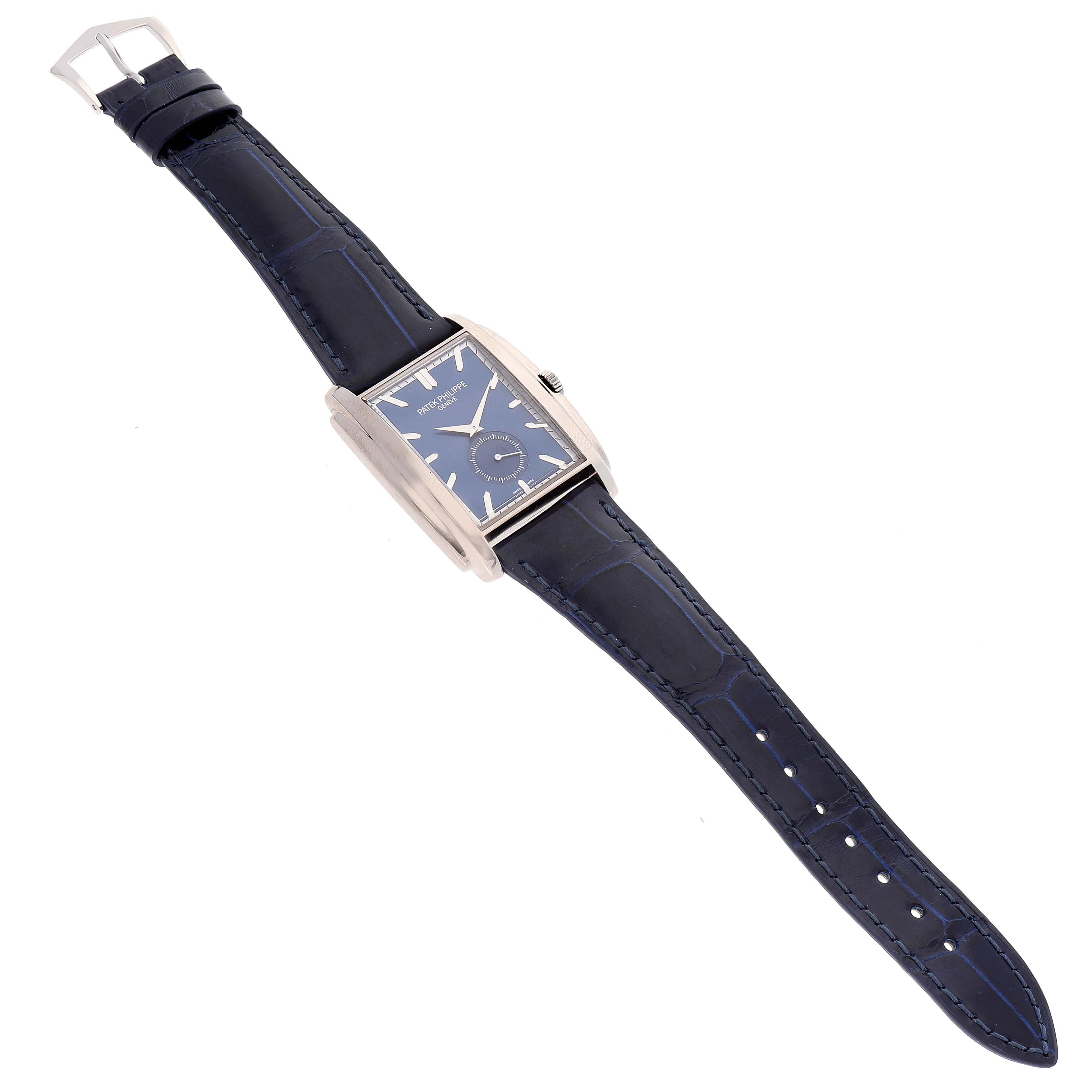 This image shows a Patek Philippe Gondolo 5124G Men's White Gold Blue Dial 5124G Men's White Gold Blue Dial watch at an angled top-down view, displaying its face, strap, and buckle.