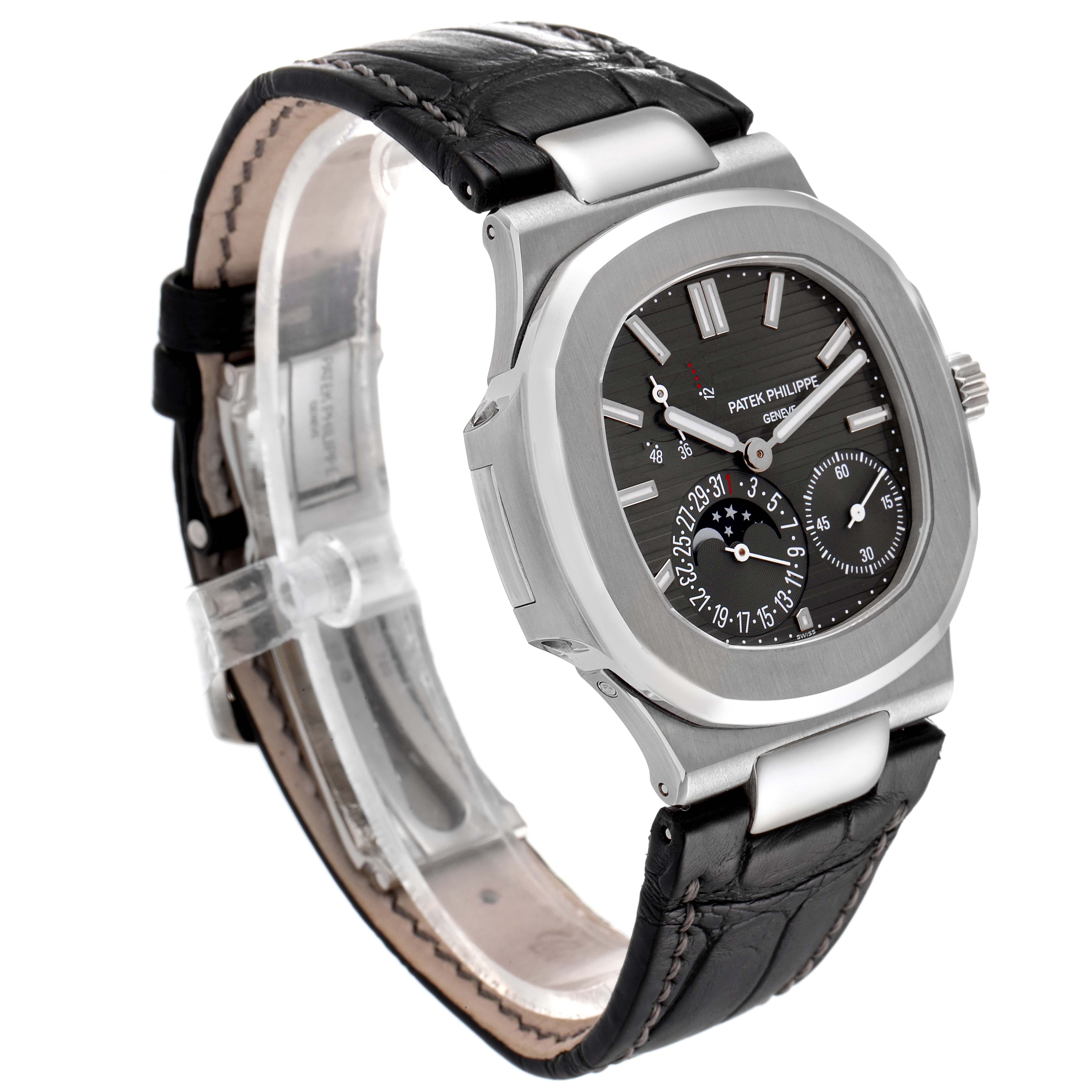 The Patek Philippe Nautilus 5712G/001 Men's White Gold Grey Dial 5712G/001 Men's White Gold Grey Dial watch is shown at a three-quarter angle, highlighting its face, bezel, crown, and leather strap.