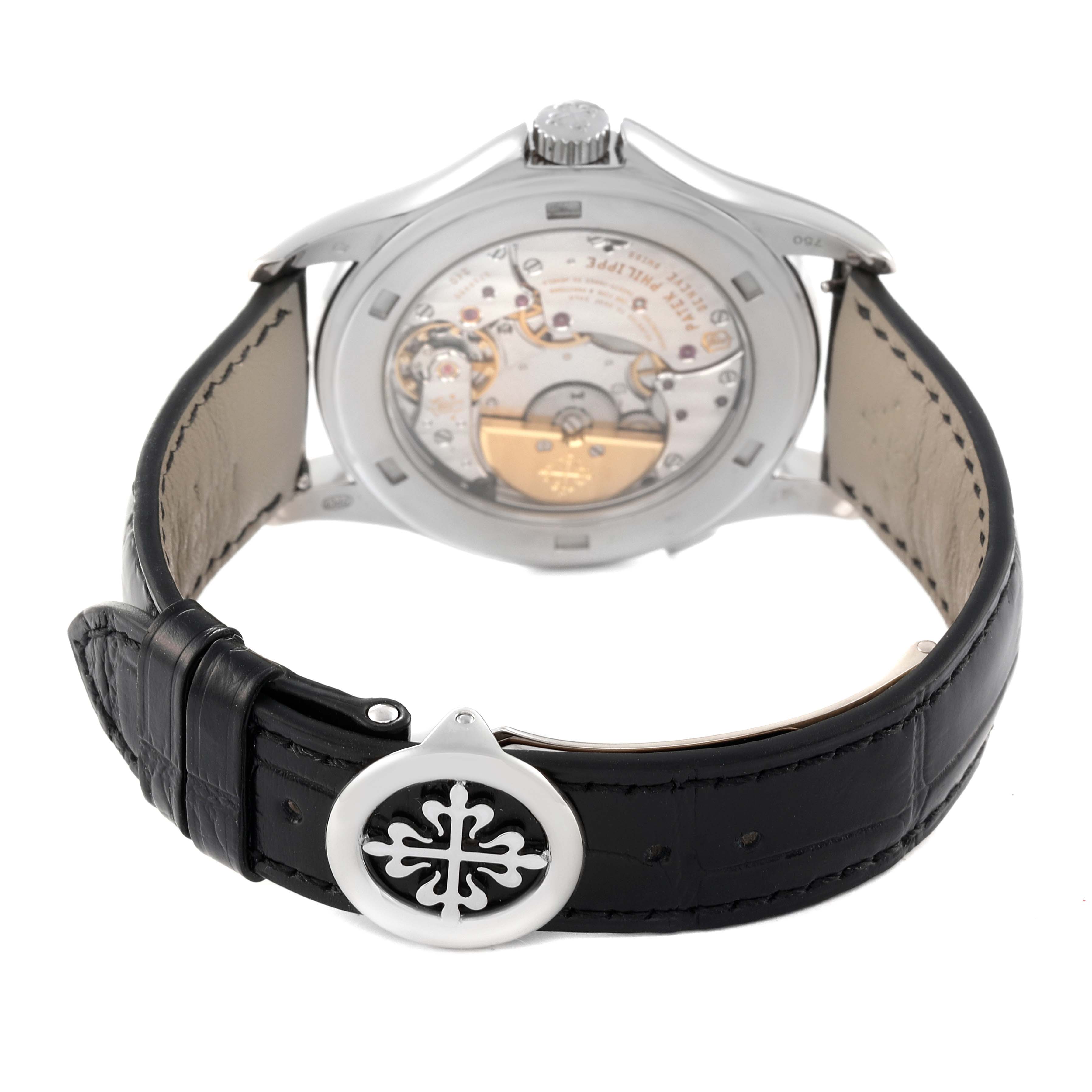 This image shows the backside of a Patek Philippe Complications 5130G-019 Men's White Gold Silver Dial 5130G-019 Men's White Gold Silver Dial model, highlighting its movement and leather strap with an emblematic clasp.