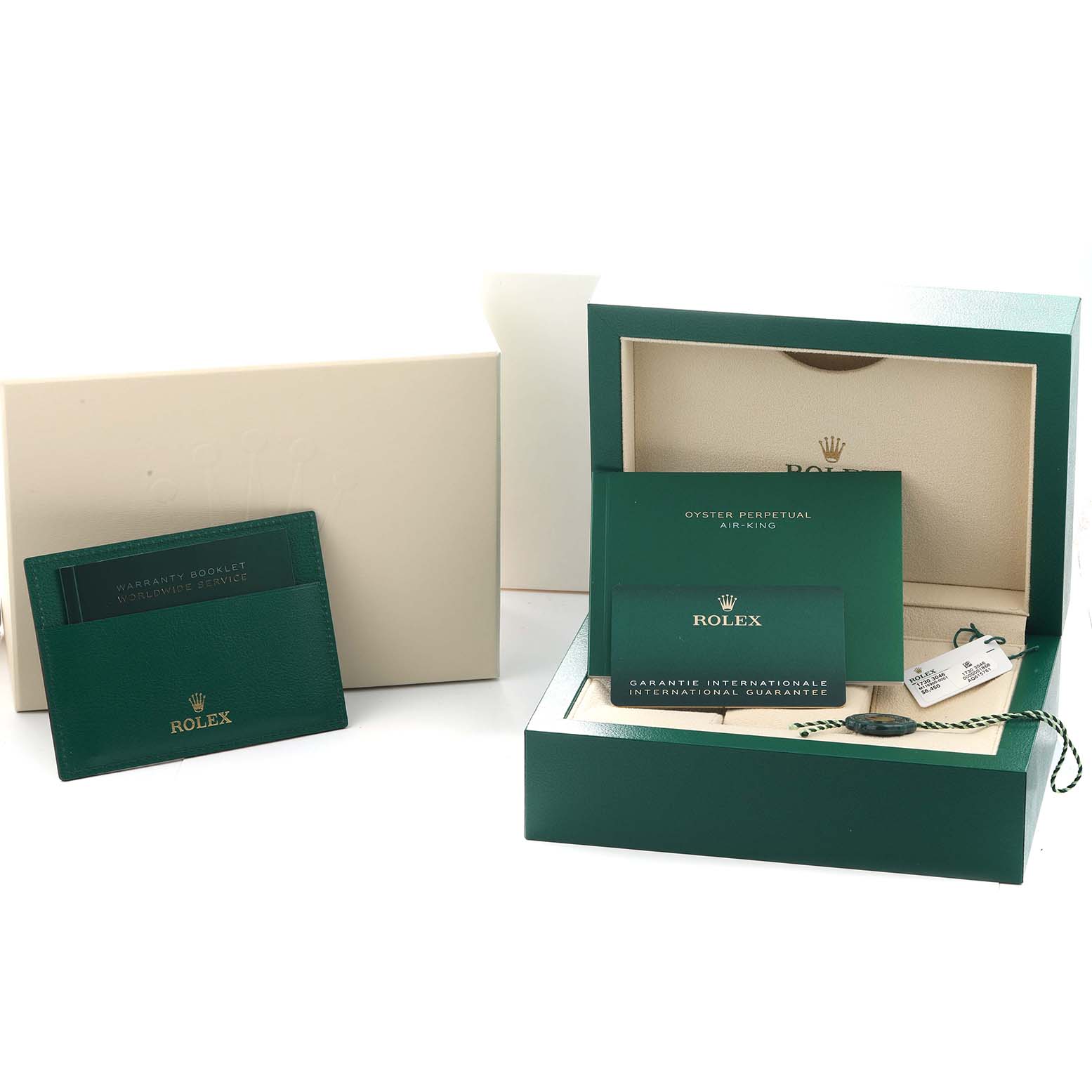 The image shows the Rolex Air-King 116900 Men
s Stainless Steel Black Dial packaging, including the box, warranty booklet, and international guarantee card.