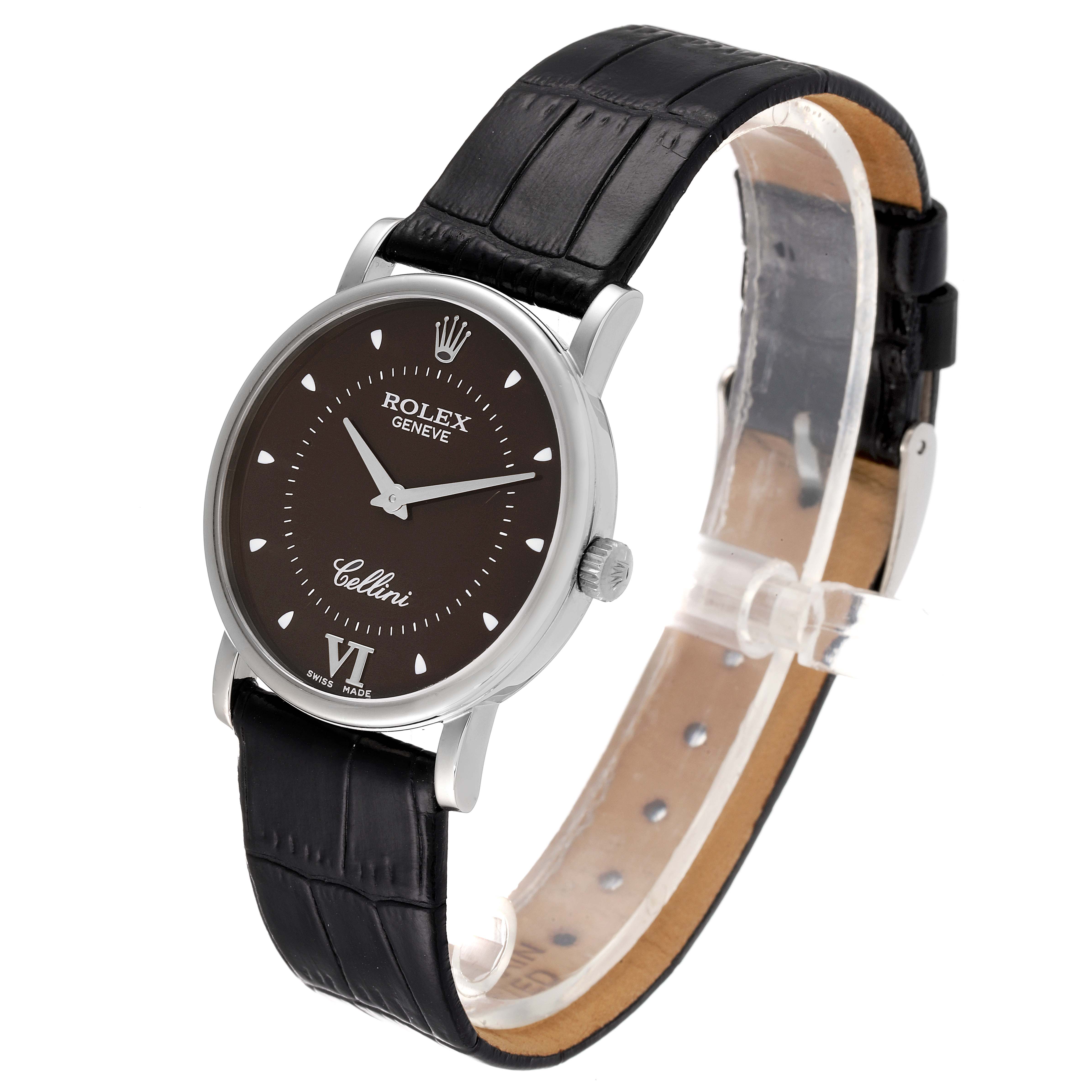 The Rolex Cellini 5115 Men's White Gold Brown Dial 5115 Men's White Gold Brown Dial watch is shown at an angle displaying the face, bezel, and part of the black leather strap.