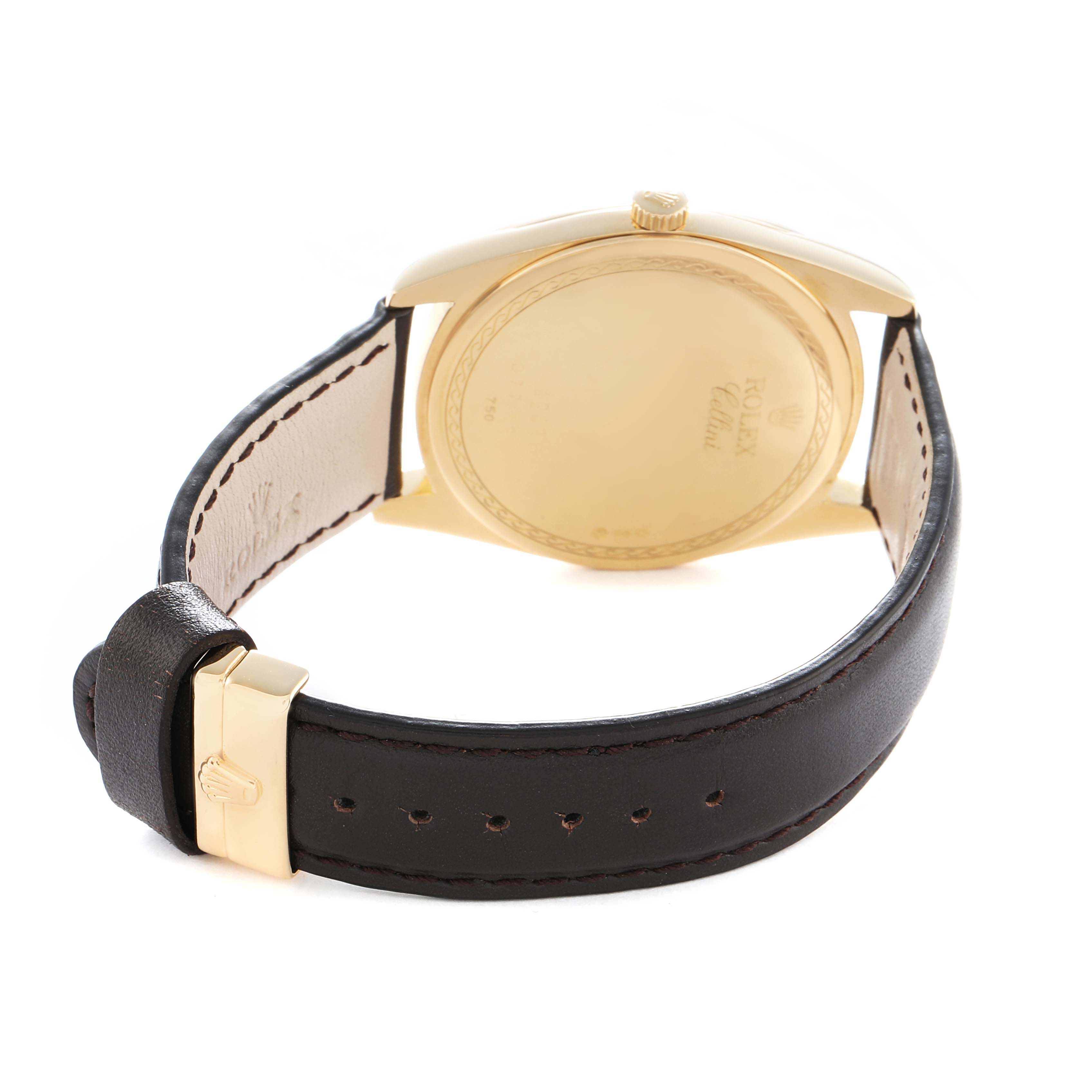 The image shows a Rolex Cellini 4243 Men
s Yellow Gold Champagne Dial watch from the back, highlighting the case back, crown, and leather strap with buckle.