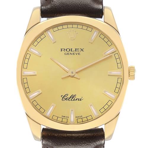 The image shows a Rolex Cellini 4243 Men's Yellow Gold Champagne Dial watch face directly, highlighting its dial, crown, markers, and part of the leather strap.
