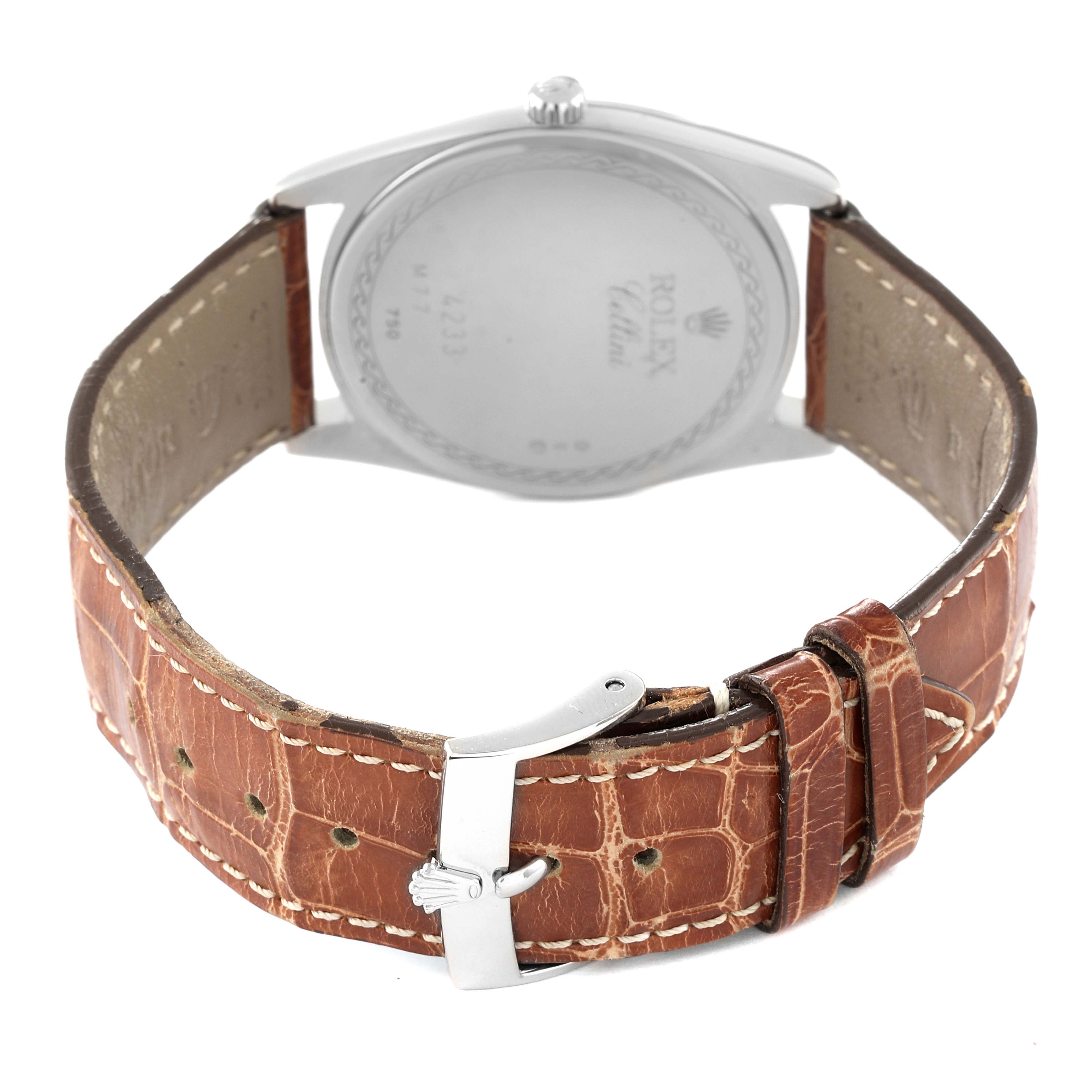 This image shows the back of a Rolex Cellini 4233 Men's Rose Gold Black Dial 4233 Men's Rose Gold Black Dial watch, highlighting the case back and brown leather strap with a clasp.