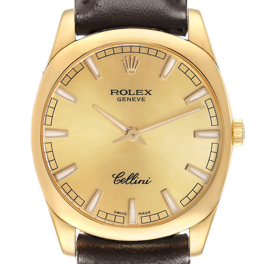 The Rolex Cellini 4243 Men's Yellow Gold Champagne Dial watch is shown from a front angle, highlighting the gold face, crown, indices, and leather strap.