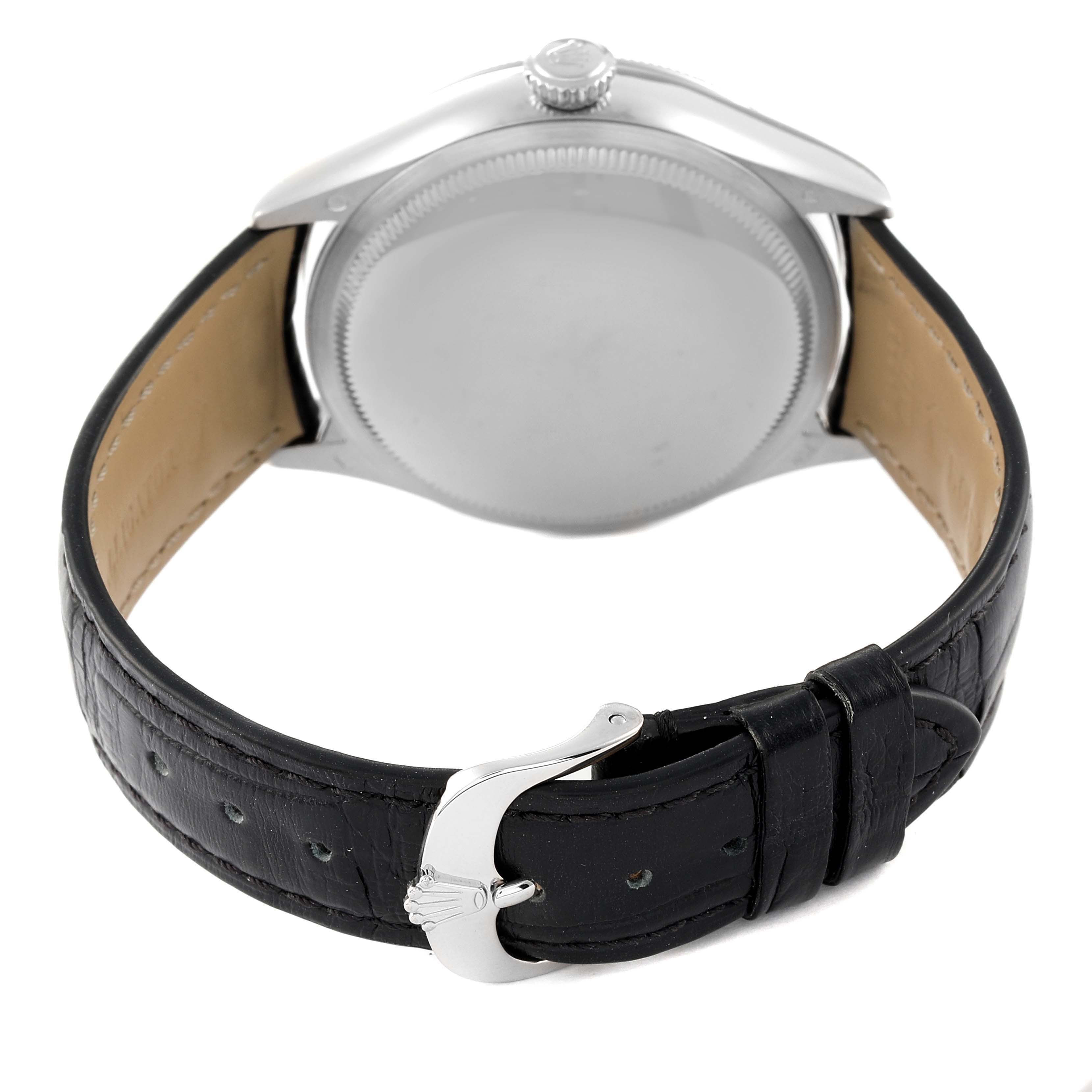 The image shows the back angle of a Rolex Cellini 50519 Men
s White Gold Silver Dial 50519 Men
s White Gold Silver Dial watch, highlighting its case back, crown, leather strap, and buckle.