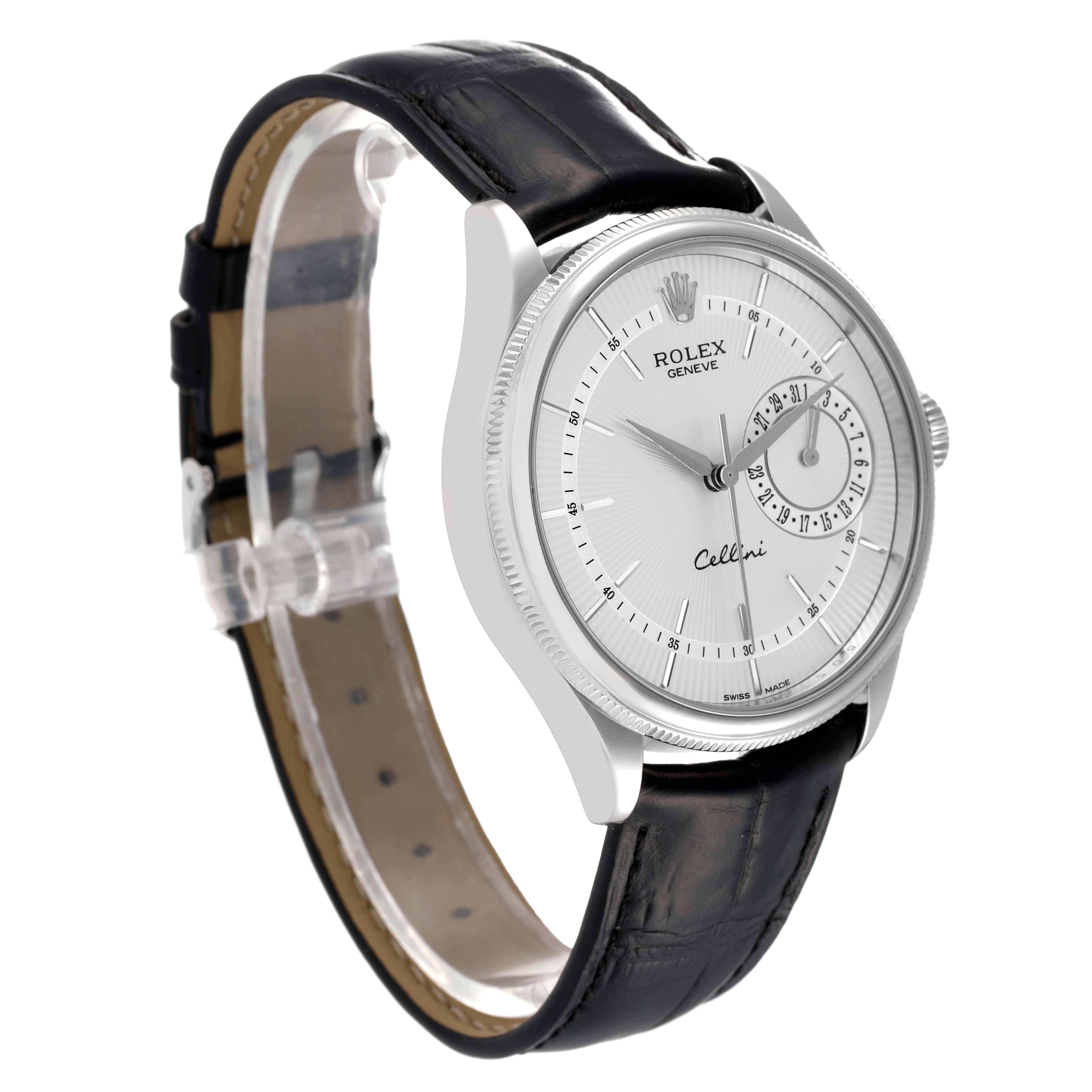 The image shows a Rolex Cellini 50519 Men
s White Gold Silver Dial 50519 Men
s White Gold Silver Dial watch from an angled side view, highlighting the face, bezel, and black leather strap.