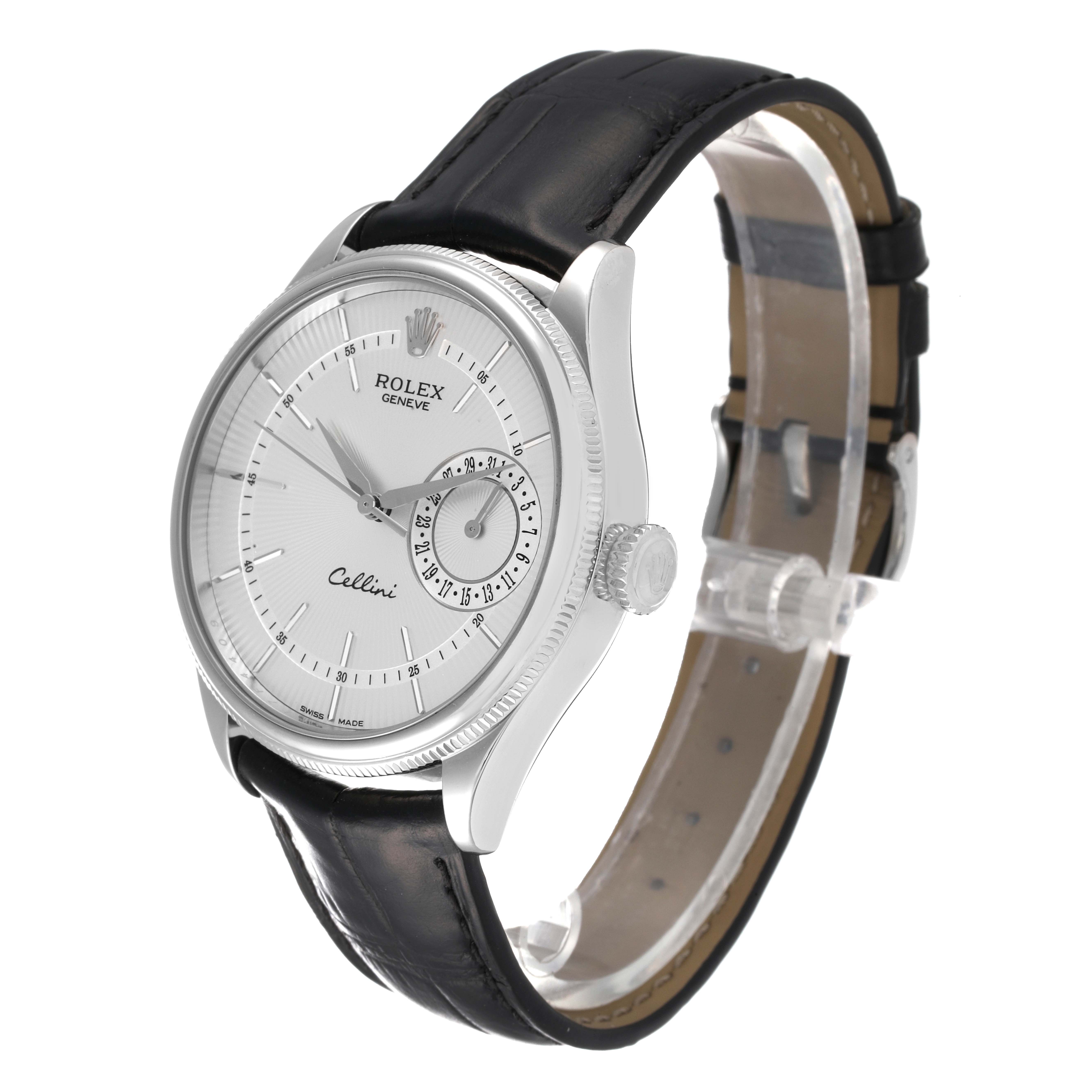 The Rolex Cellini 50519 Men
s White Gold Silver Dial 50519 Men
s White Gold Silver Dial watch is shown at an angled view, displaying its white dial, sub-dial, silver case, and black leather strap.