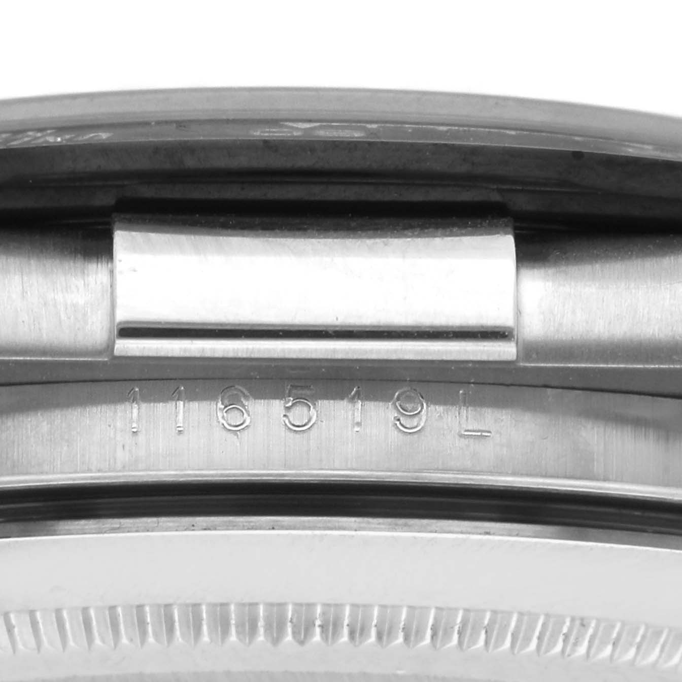 The image shows a close-up side view of a Rolex Daytona 116519 Men
s White Gold Silver Dial, highlighting the engraved serial number on the case.
