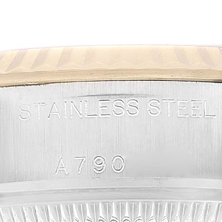 This close-up image shows the side engraving, bezel, and part of the case back of the Rolex Datejust 79173 Women's Steel and Gold (two tone) White Dial 79173 Women's Steel and Gold (two tone) White Dial model, highlighting the "STAINLESS STEEL" inscription.