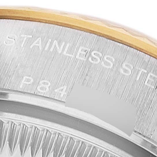 This close-up image shows the edge of the dial and bezel of a Rolex Datejust 79173 Women's Steel and Gold (two tone) White Dial 79173 Women's Steel and Gold (two tone) White Dial watch, highlighting the "STAINLESS STEEL" engraving.