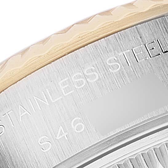 This image shows a close-up of the case back edge and part of the bezel of a Rolex Datejust 69173 Women's Steel and Gold (two tone) Champagne Dial 69173 Women's Steel and Gold (two tone) Champagne Dial, highlighting the "STAINLESS STEEL" text.