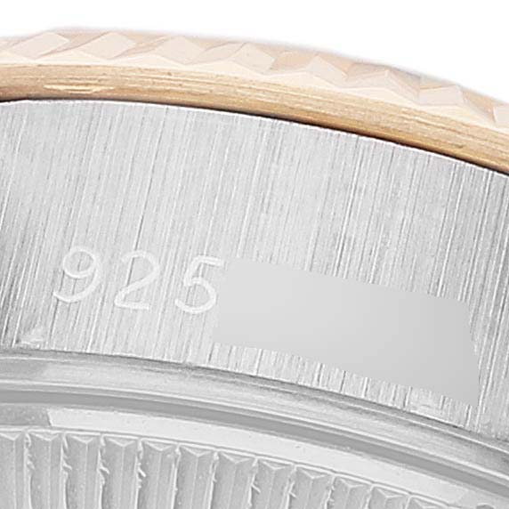 This close-up image shows the bezel and part of the case of a Rolex Datejust 69173 Women's Steel and Gold (two tone) Champagne Dial 69173 Women's Steel and Gold (two tone) Champagne Dial watch.