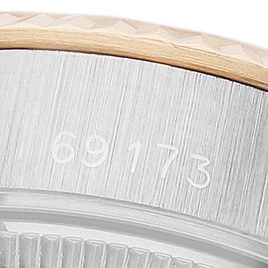 This close-up image of a Rolex Datejust 69173 Women's Steel and Gold (two tone) Champagne Dial 69173 Women's Steel and Gold (two tone) Champagne Dial watch focuses on the side of the case, showing the reference number 69173.