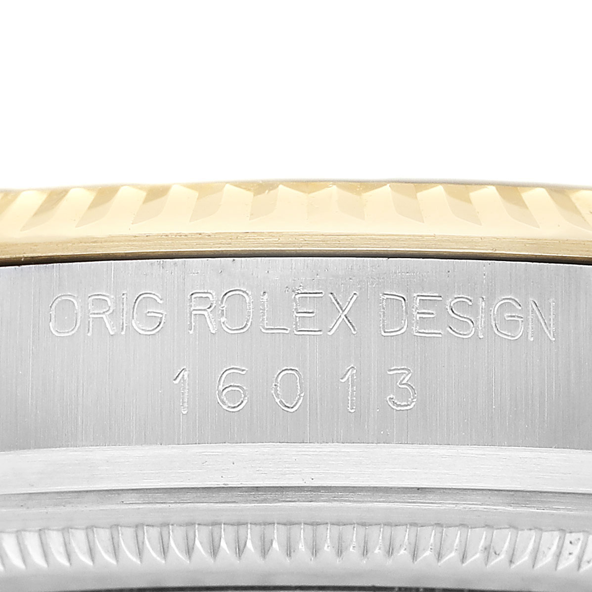 The image shows a close-up of the case side of a Rolex Datejust 16013 Men's Steel and Gold (two tone) Champagne Dial, highlighting the model number and bezel edge.