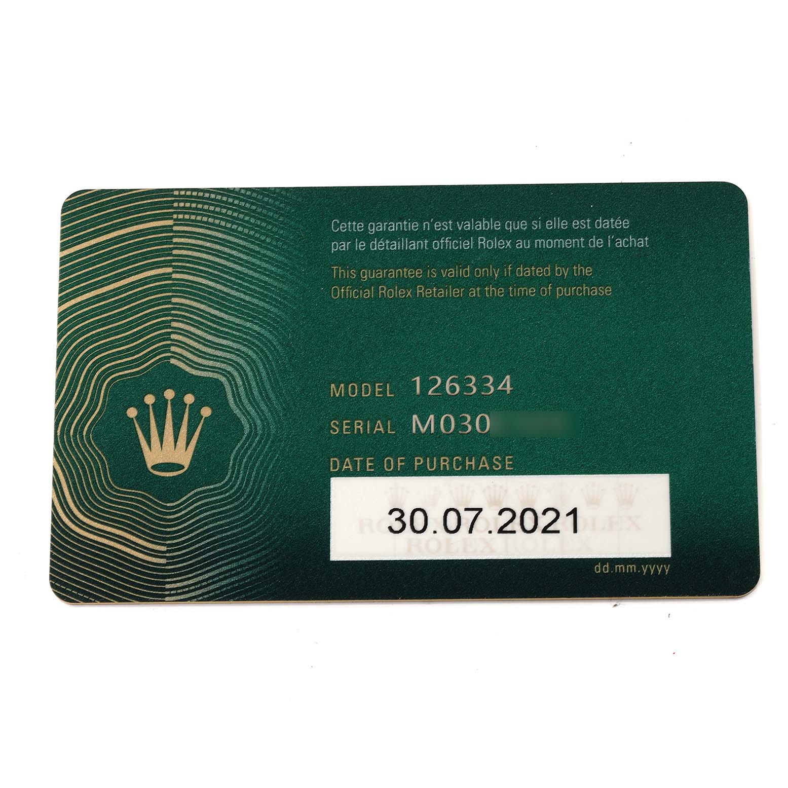 The image shows a green warranty card for a Datejust 41 Rolex, displaying the model, serial number, and date of purchase.