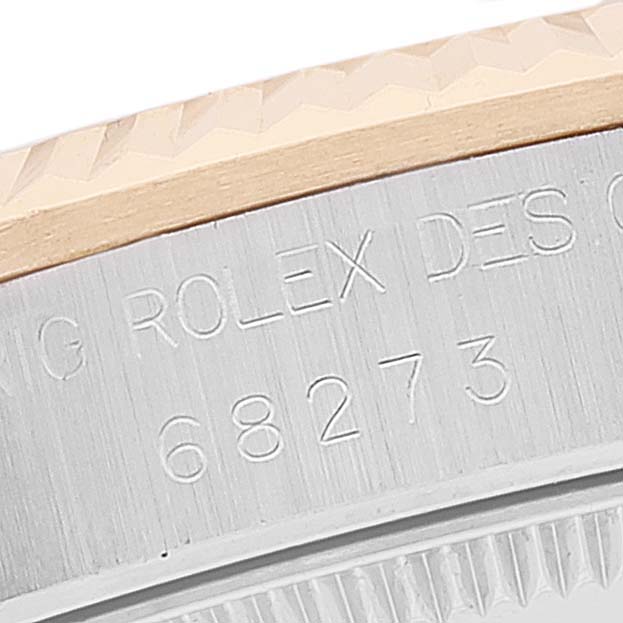 The image shows a close-up of the engraved case back and serial number of a Rolex Mid-Size 68273 Women's Steel and Gold (two tone) Mother of Pearl Dial 68273 Women's Steel and Gold (two tone) Mother of Pearl Dial model.