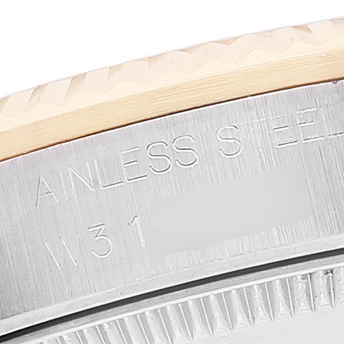 This close-up image shows the steel case back of a Rolex Mid-Size 68273 Women's Steel and Gold (two tone) Mother of Pearl Dial 68273 Women's Steel and Gold (two tone) Mother of Pearl Dial watch, with partial engravings visible.