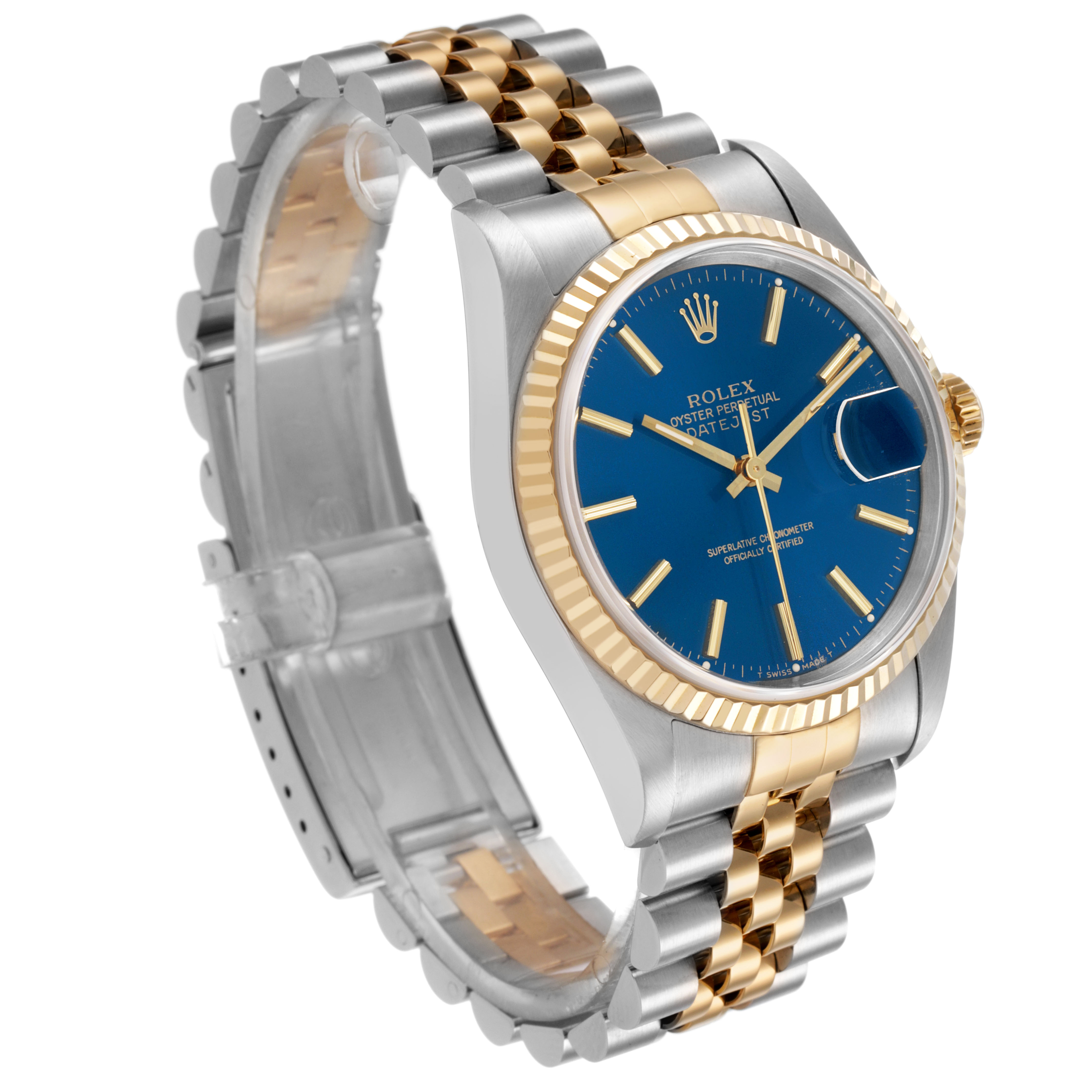 The Rolex Datejust 16233 Men's Steel and Gold (two tone) Blue Dial watch is shown at a three-quarter angle, highlighting the blue dial, fluted bezel, and two-tone Jubilee bracelet.