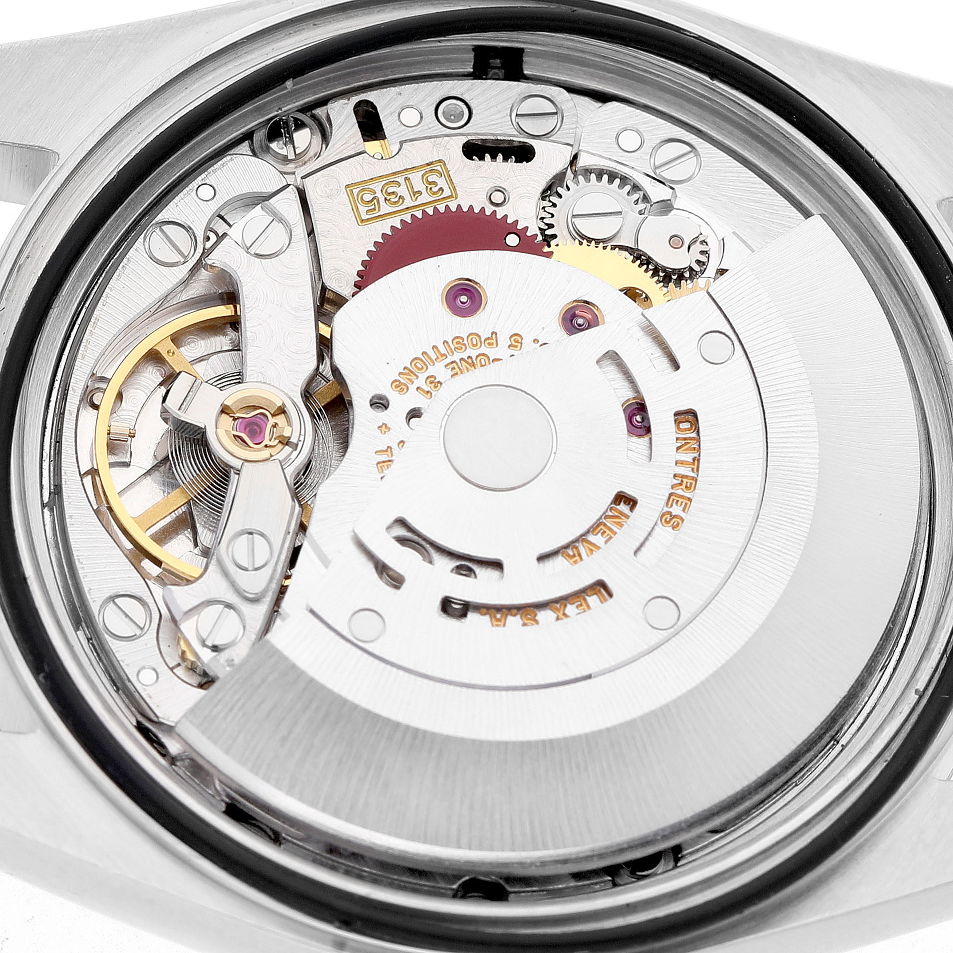 The image shows the movement of a Rolex Datejust 16233 Men's Steel and Gold (two tone) Blue Dial watch from a rear angle, revealing intricate gears and components.