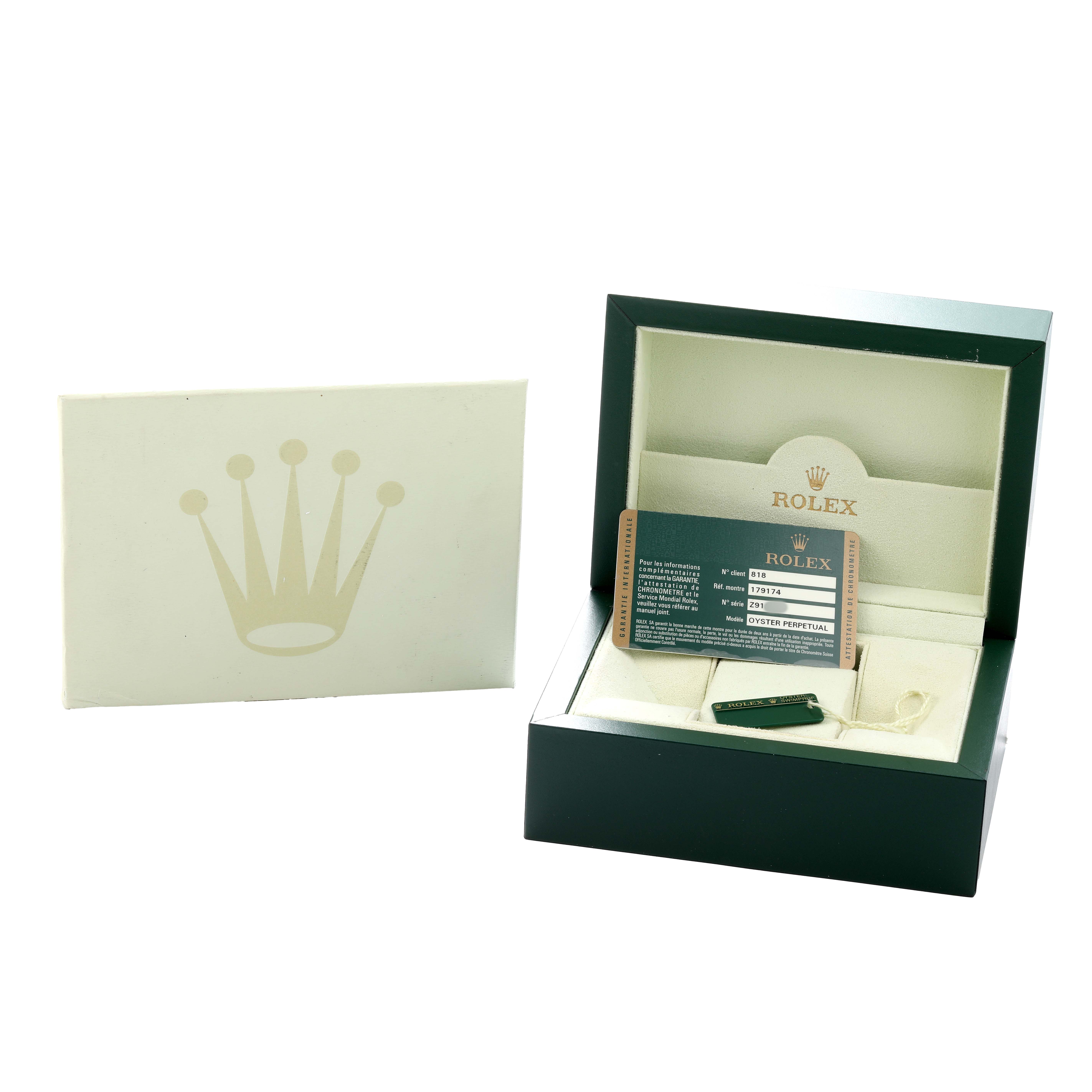 The image shows the packaging and accessories for a Rolex Datejust 179174 Women
s Stainless Steel Silver Dial, including the box, warranty card, and a tag.