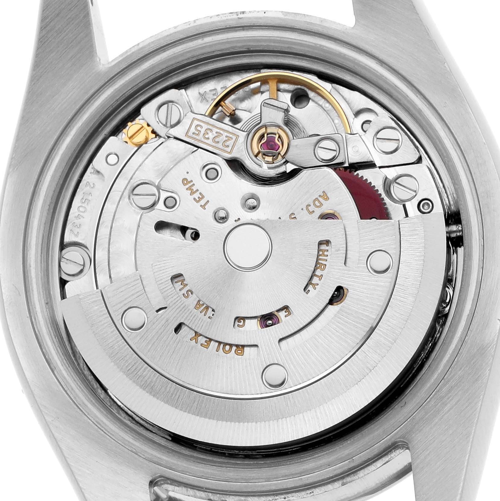 The image shows the movement of a Rolex Datejust 179174 Women
s Stainless Steel Silver Dial from the back, highlighting its intricate components and rotor.