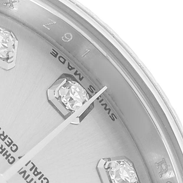 This image shows a close-up of the Rolex Datejust 179174 Women
s Stainless Steel Silver Dial dial, highlighting diamond hour markers and the "Swiss Made" text.