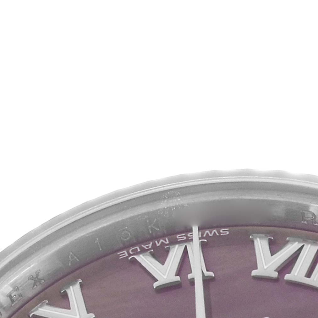 The image shows a close-up of the Rolex Datejust 179174 Men
s Stainless Steel Mother of Pearl Dial dial edge, highlighting Roman numerals and part of the bezel.