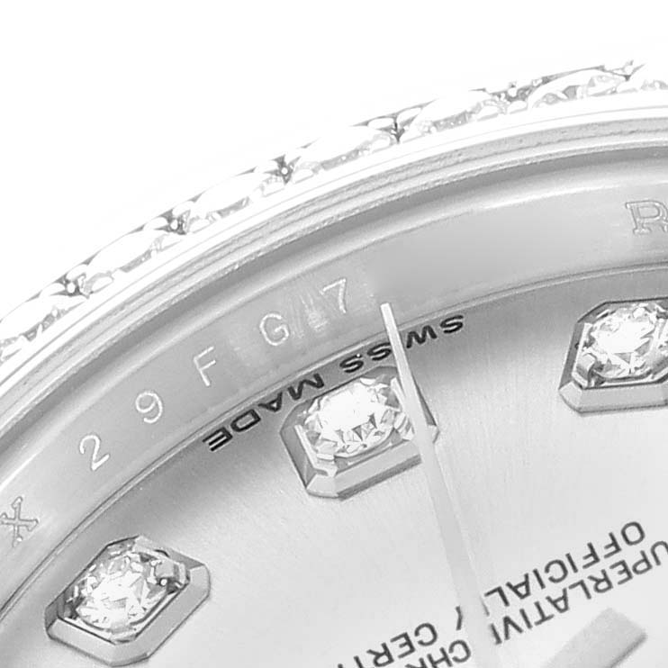 The image shows a close-up of the Rolex Datejust 179384 Women
s Stainless Steel Silver Dial watch face, focusing on diamond hour markers and partial bezel detail.