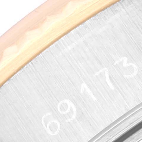 The image shows a close-up of the edge of a Rolex Datejust 69173 Women's Steel and Gold (two tone) Blue Dial 69173 Women's Steel and Gold (two tone) Blue Dial model watch case with the engraved number "69173".