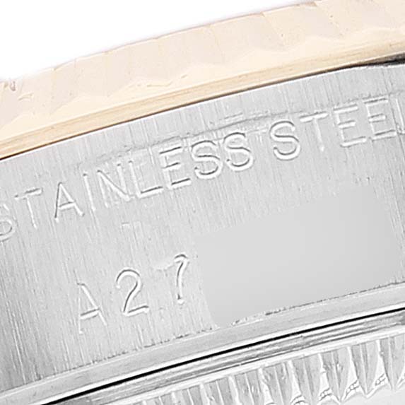 This close-up image shows the engraved markings on the stainless steel case side of a Rolex Date 79173 Women's Steel and Gold (two tone) Champagne Dial 79173 Women's Steel and Gold (two tone) Champagne Dial model watch.