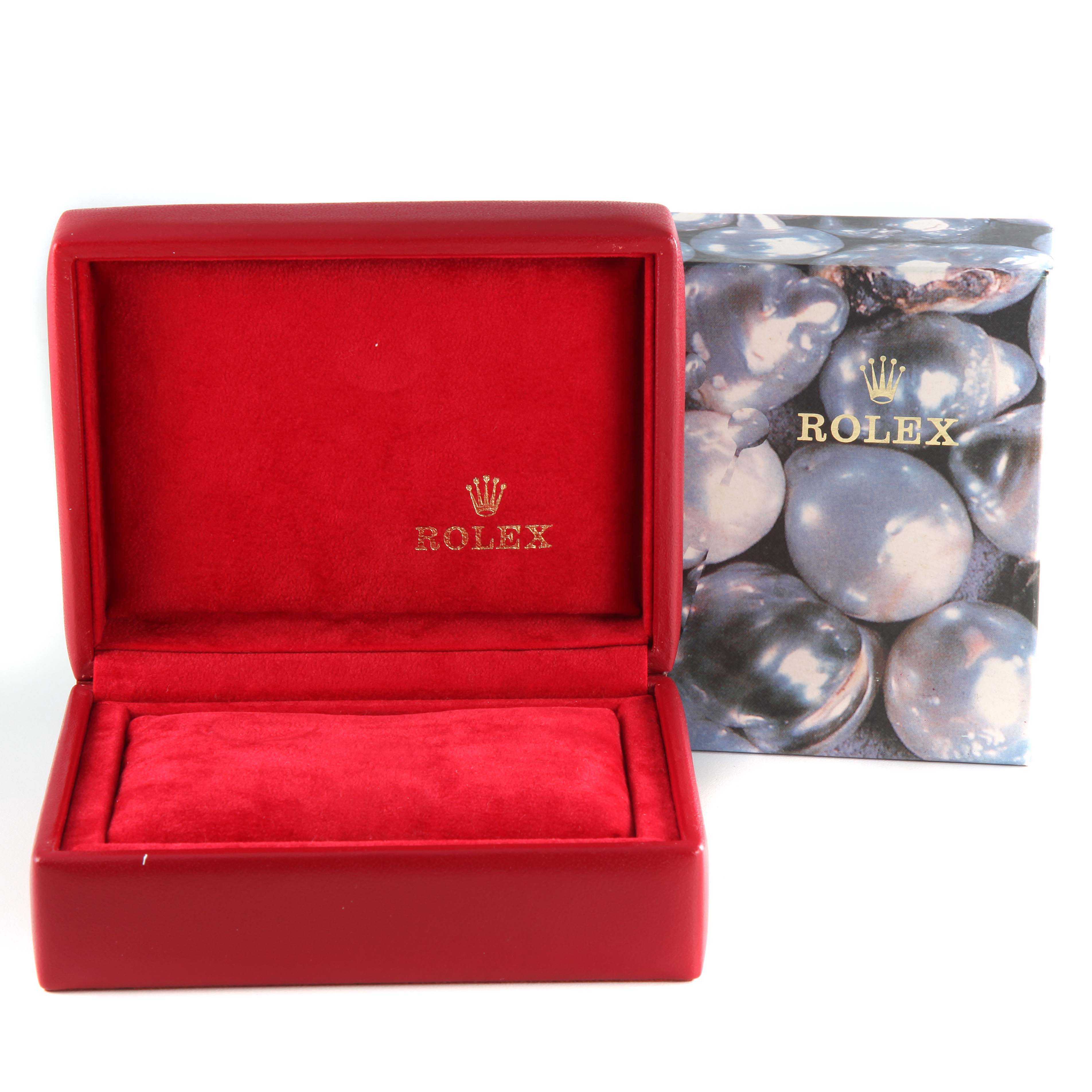 The image shows a red and gold Rolex watch box with the company logo, but does not include the Rolex Datejust 69173 Women's Steel and Gold (two tone) Beige Dial 69173 Women's Steel and Gold (two tone) Beige Dial model watch itself.