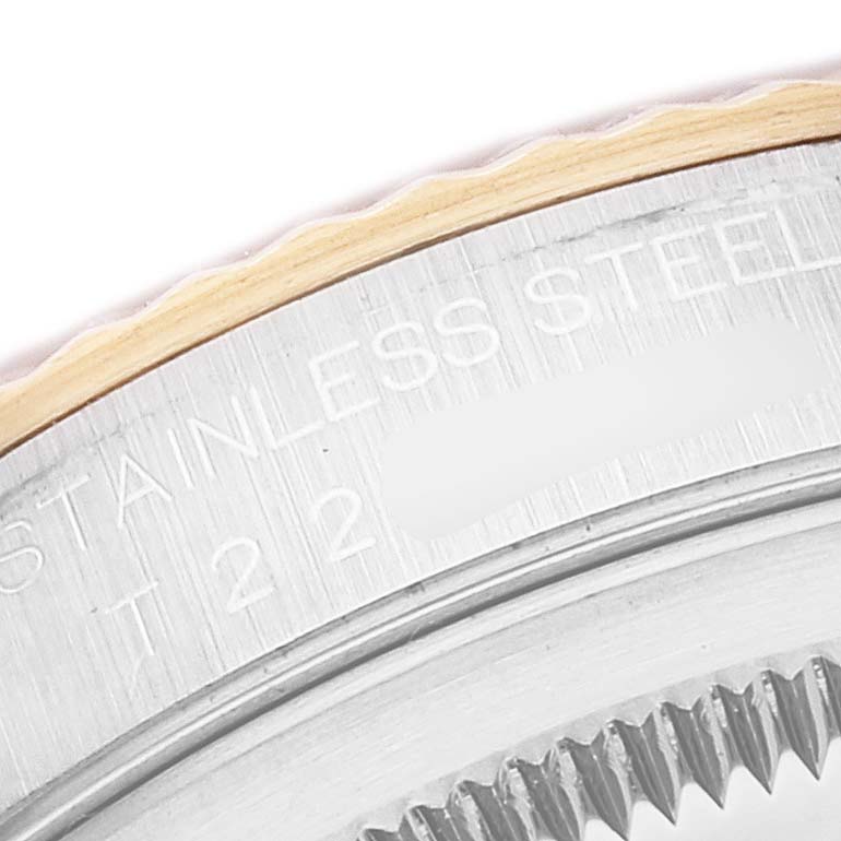 The image shows a close-up of the stainless steel case back engravings of a Rolex Datejust 16233 Men's Steel and Gold (two tone) White Dial 16233 Men's Steel and Gold (two tone) White Dial watch.