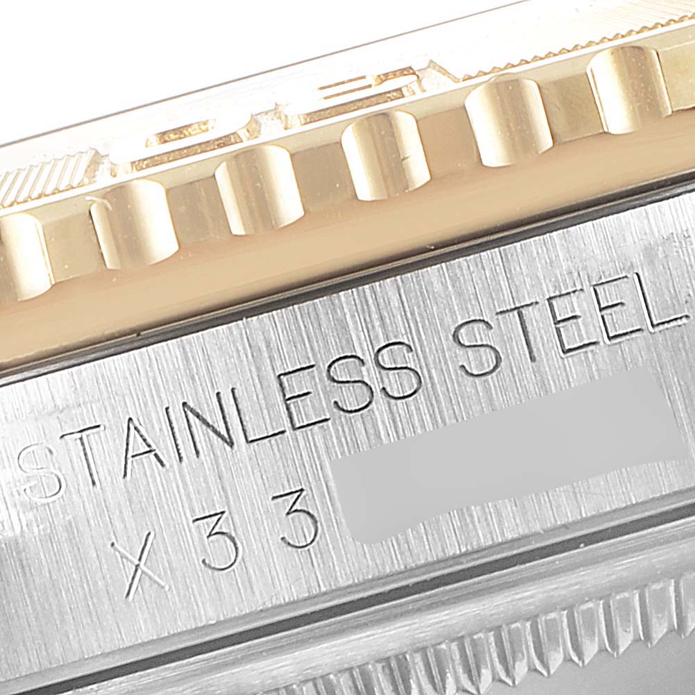 This image shows a close-up of the bezel and stainless steel case with engravings on a Rolex Turn-o-Graph 16263 Men's Steel and Gold (two tone) Champagne Dial 16263 Men's Steel and Gold (two tone) Champagne Dial watch.