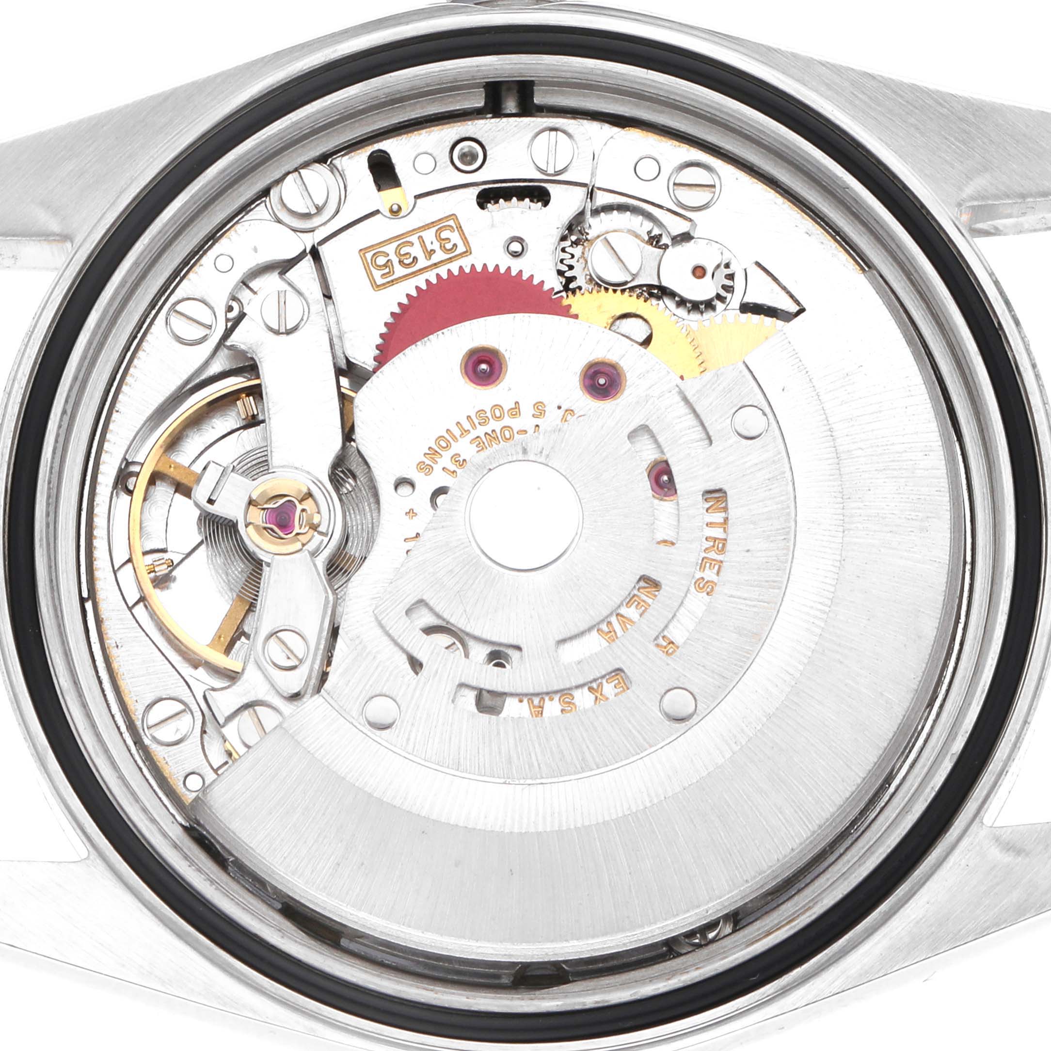 This image shows the movement of a Rolex Datejust 16233 Men
s Steel and Gold (two tone) Champagne Dial watch from the back, featuring gears and the rotor.